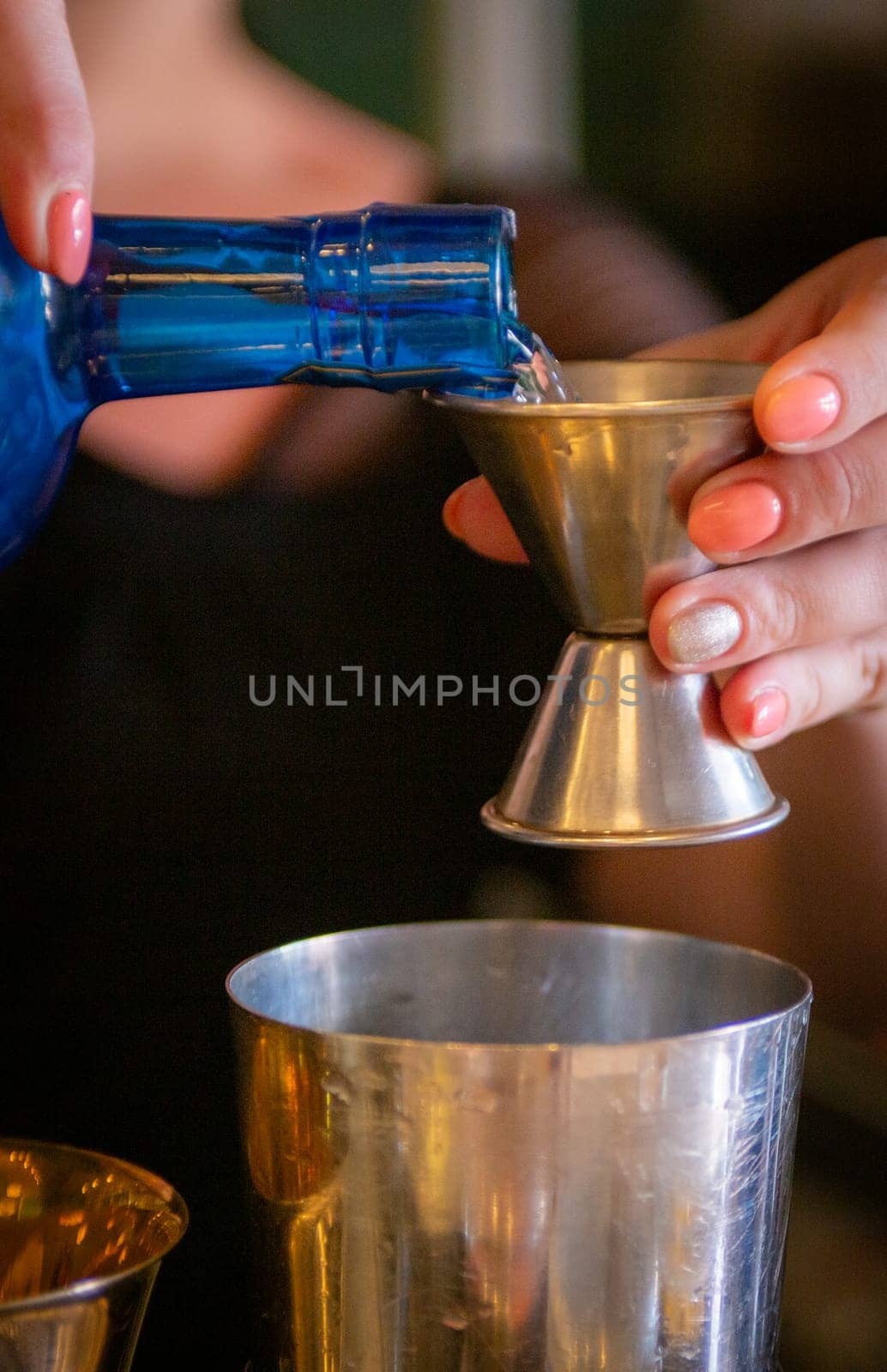 Pouring a shot to be mixed and served