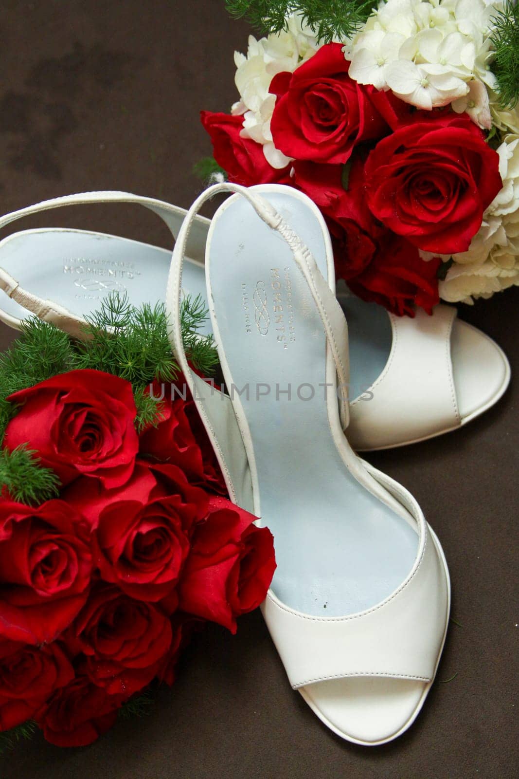 Red roses and bridal shoes by TopCreativePhotography