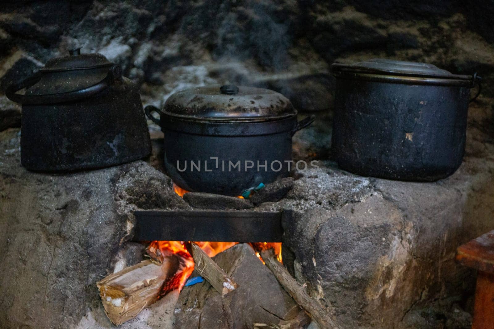 Three covered pots in Third World Peruvian Kitchen