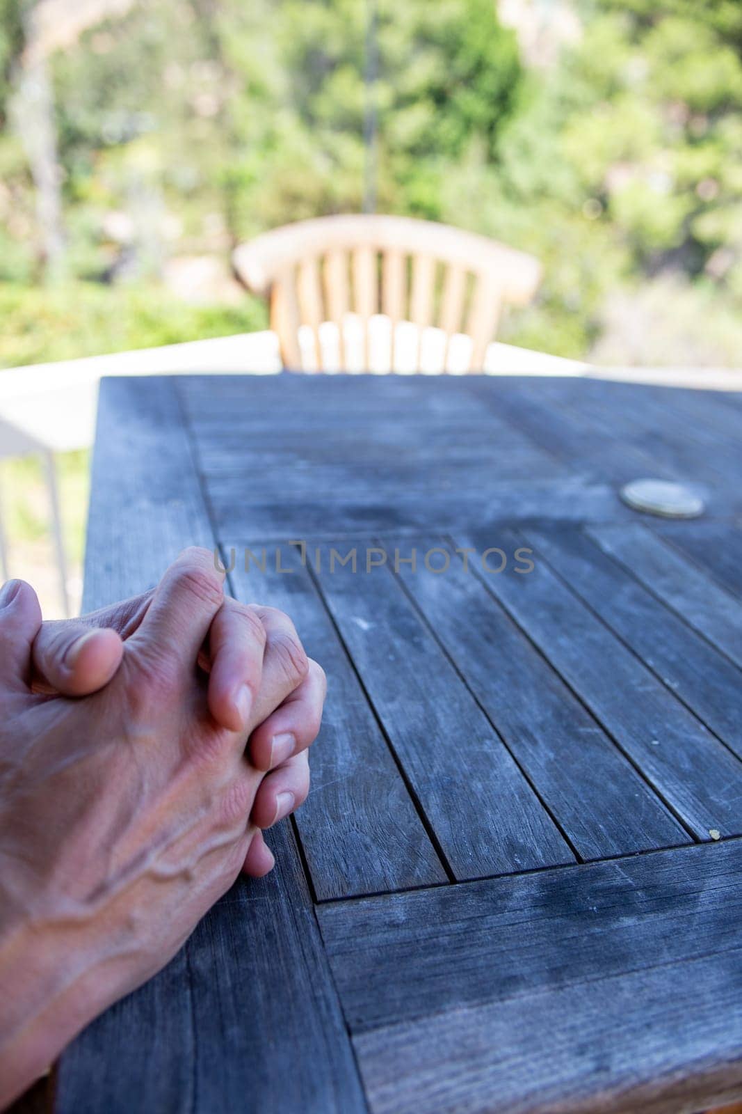 Mans hands together waiting for food