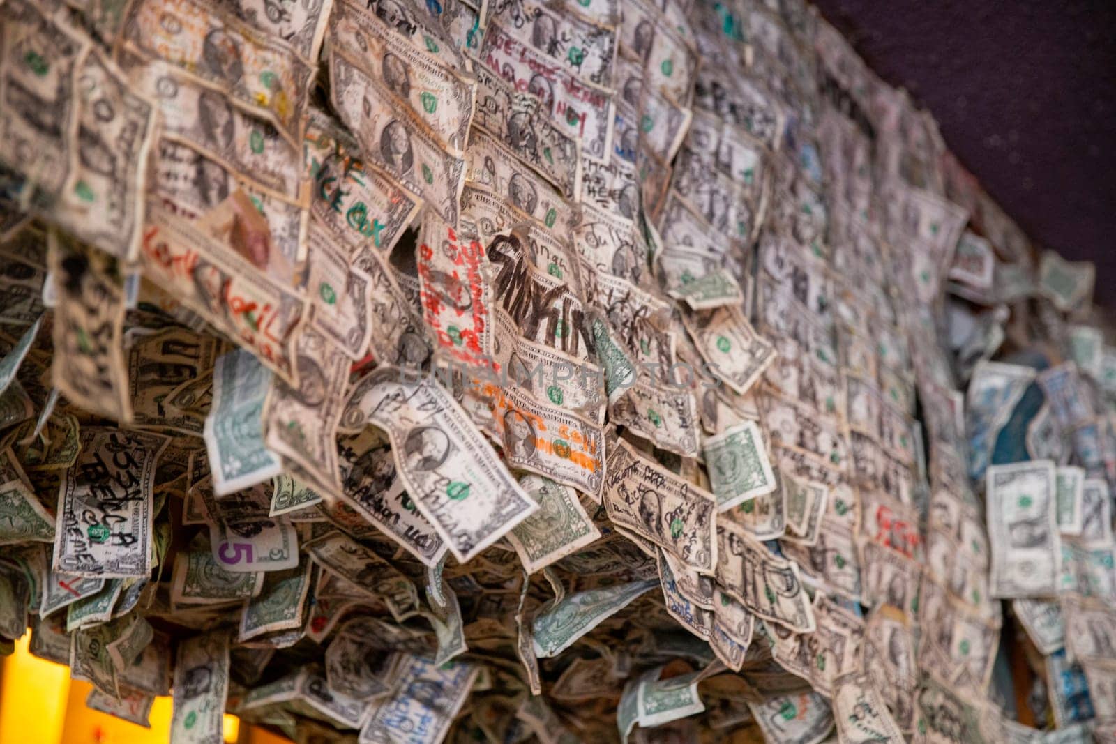 Wall of Dollar Bill Tips Signed