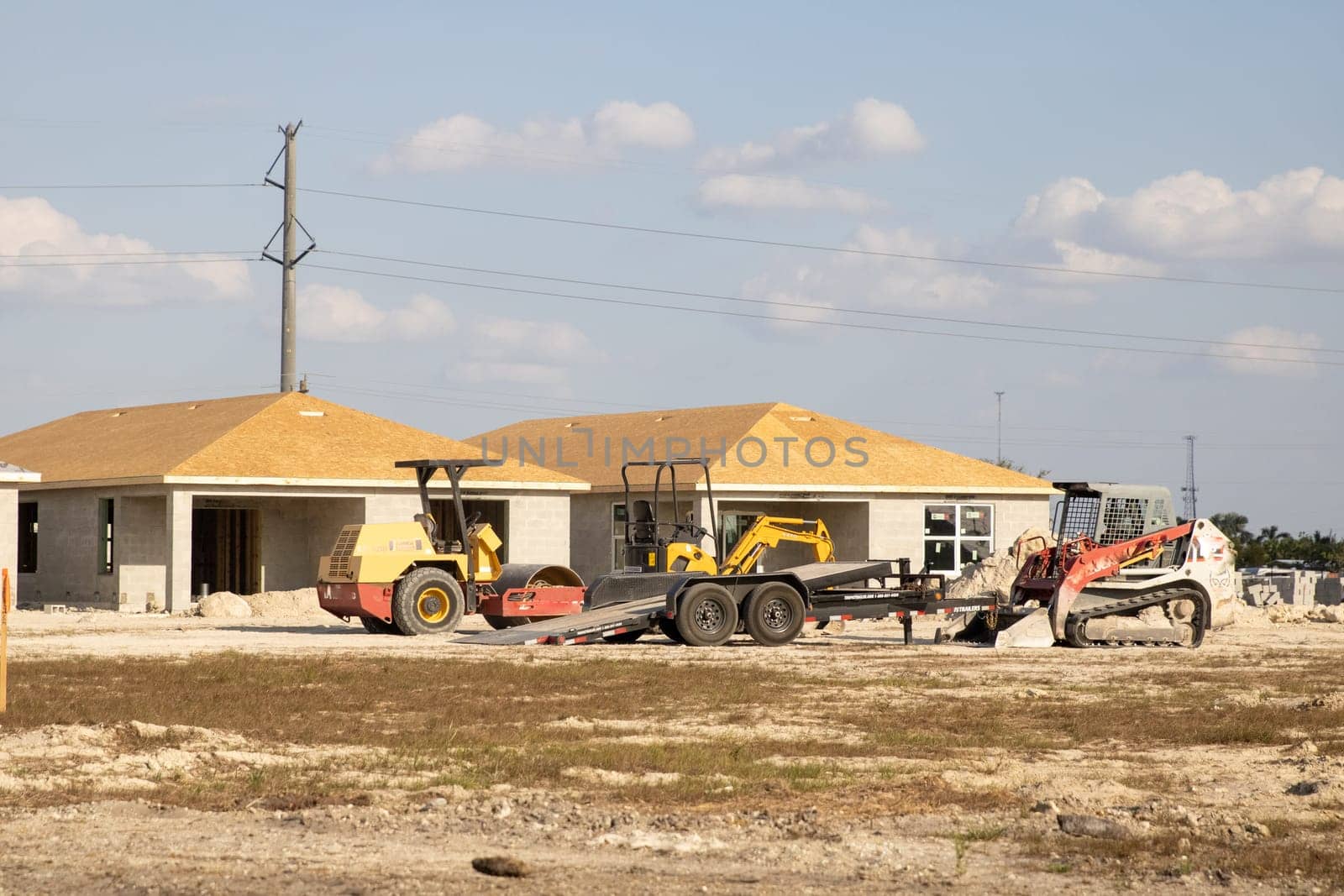 Several Houses being built on a construction site