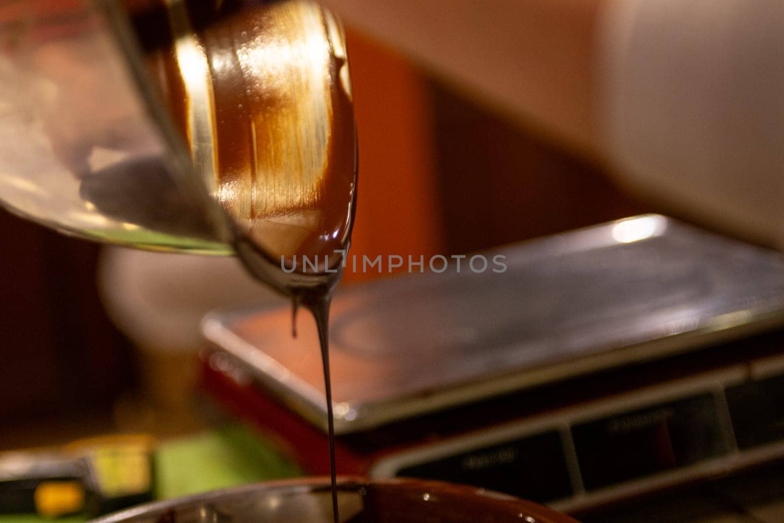 A Chocolatier Pouring Melted Chocolate