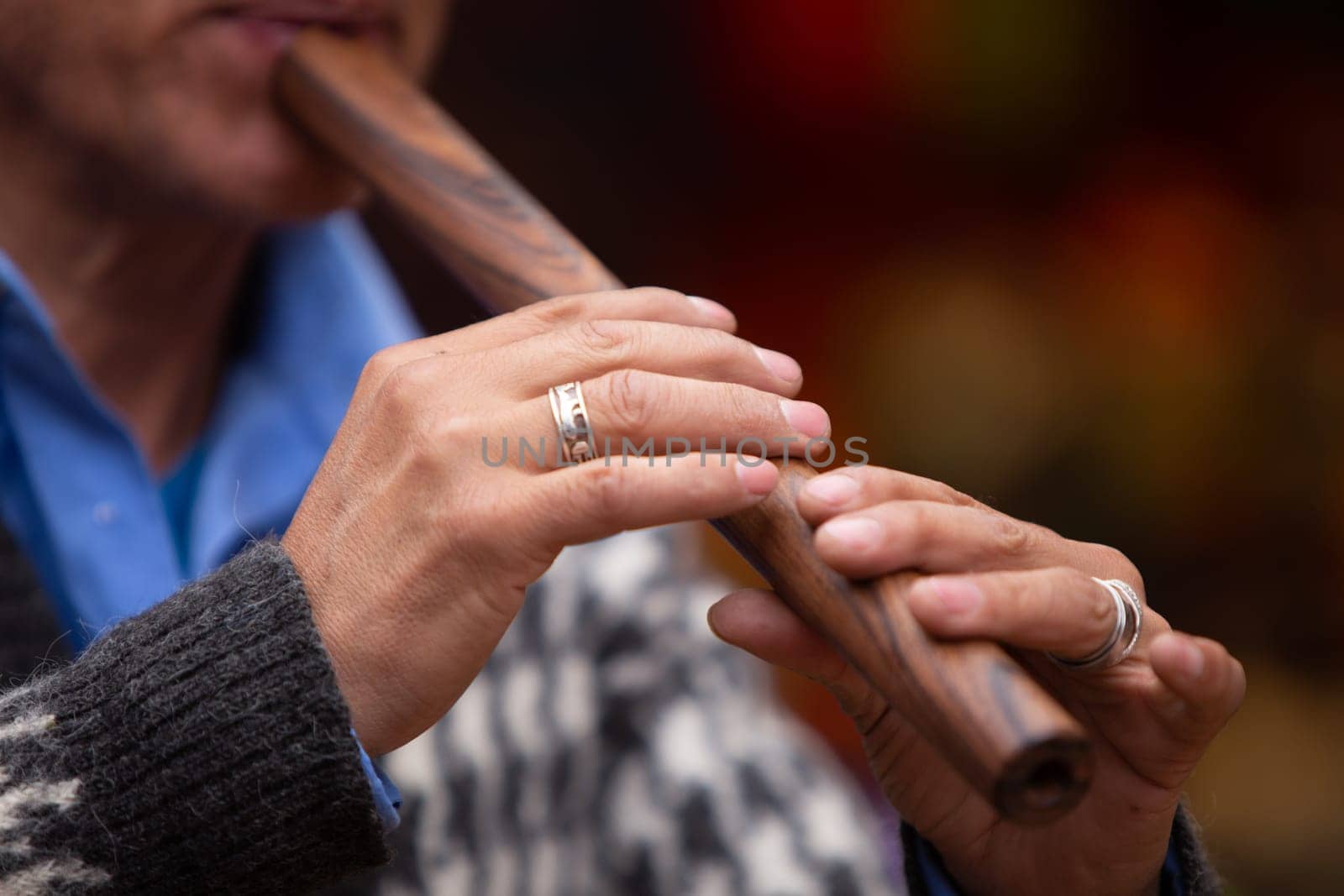 Locan Artist Man playing a peruvian flute