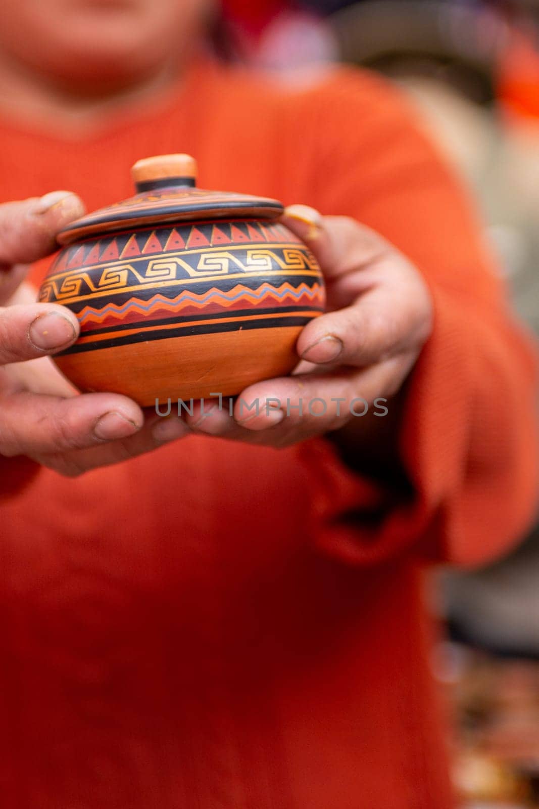 Peruvian Woman holding Souvenir container