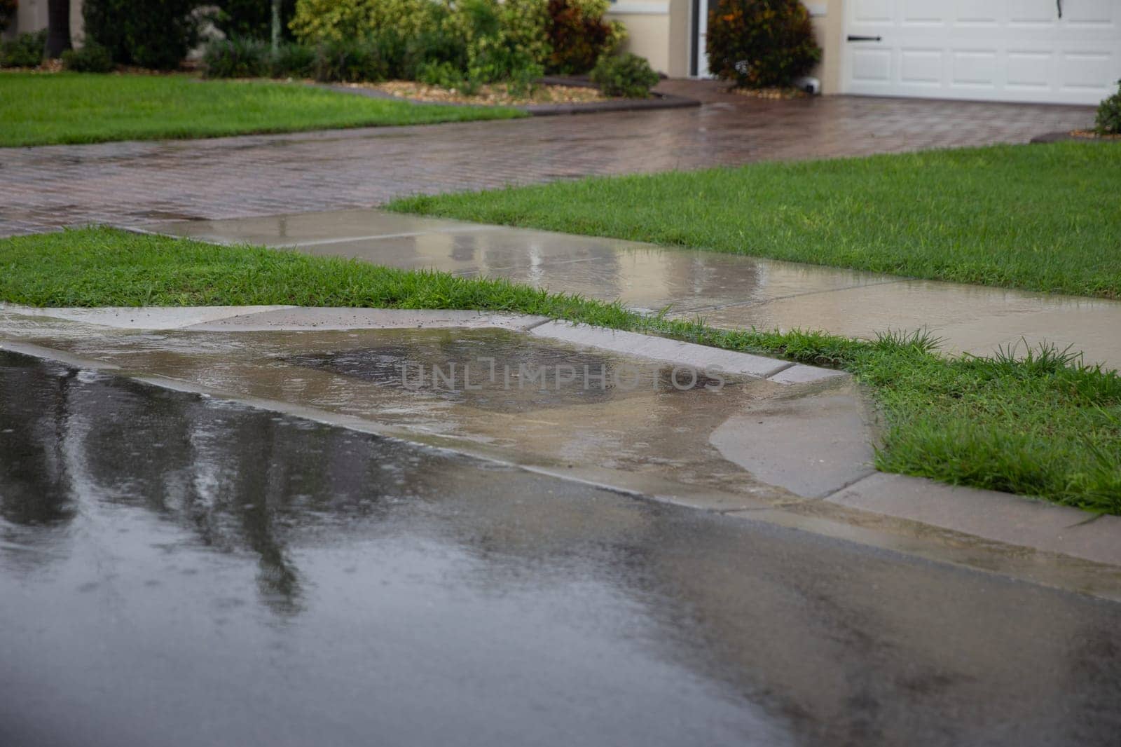 Hurricane Flooding in residential neighborhood with the storm drain clogged