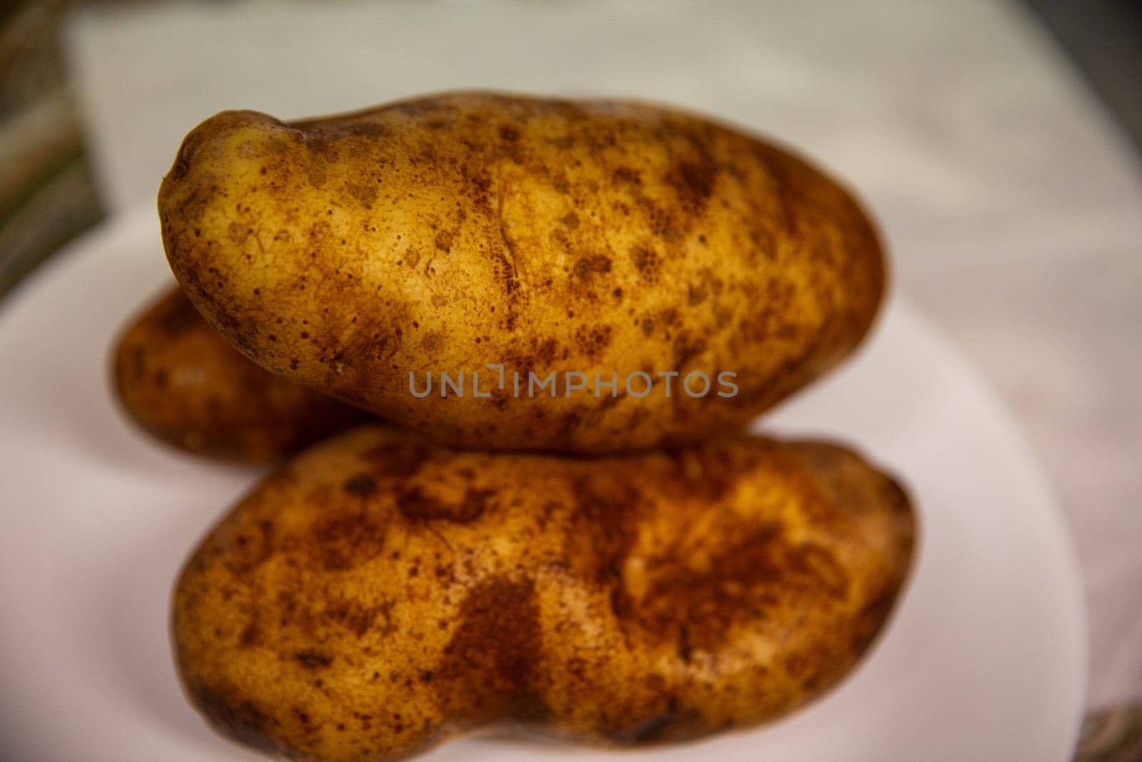 Three Russet Potatoes ready to be baked