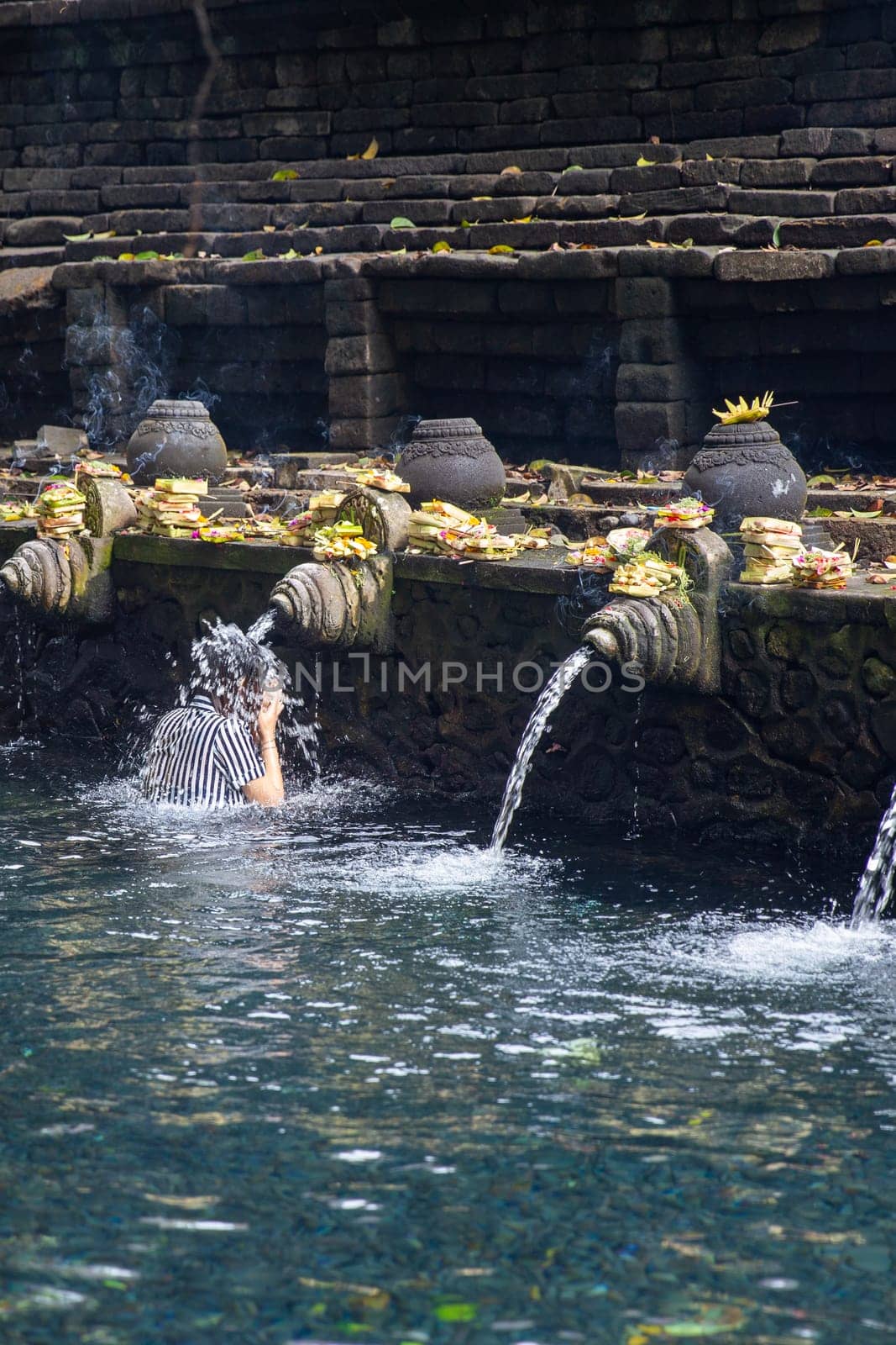 Getting purifiedat an Indonesian sacred ground