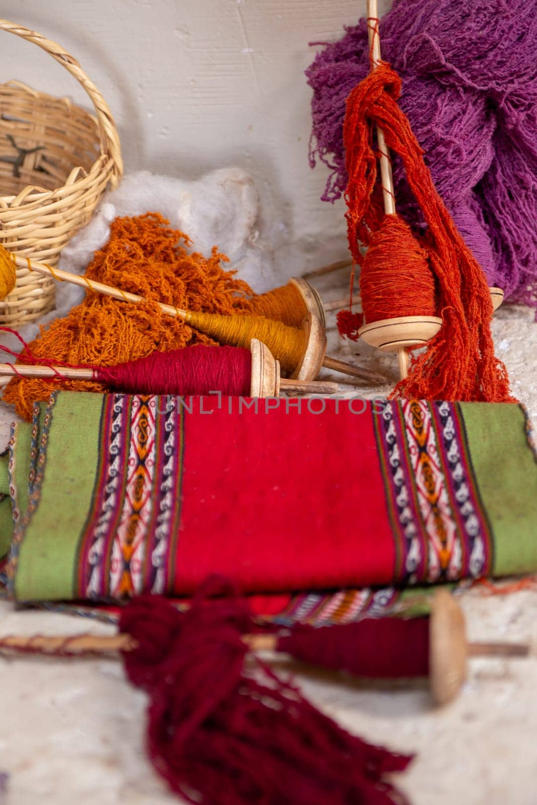 Peruvian Cloth table runner with spools of yarn