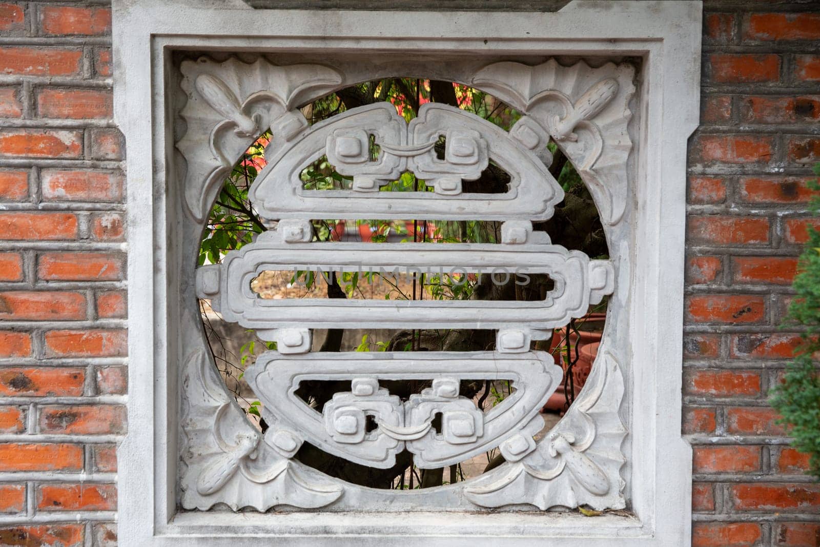 Restored Vietnamese Temple Tile in a wall