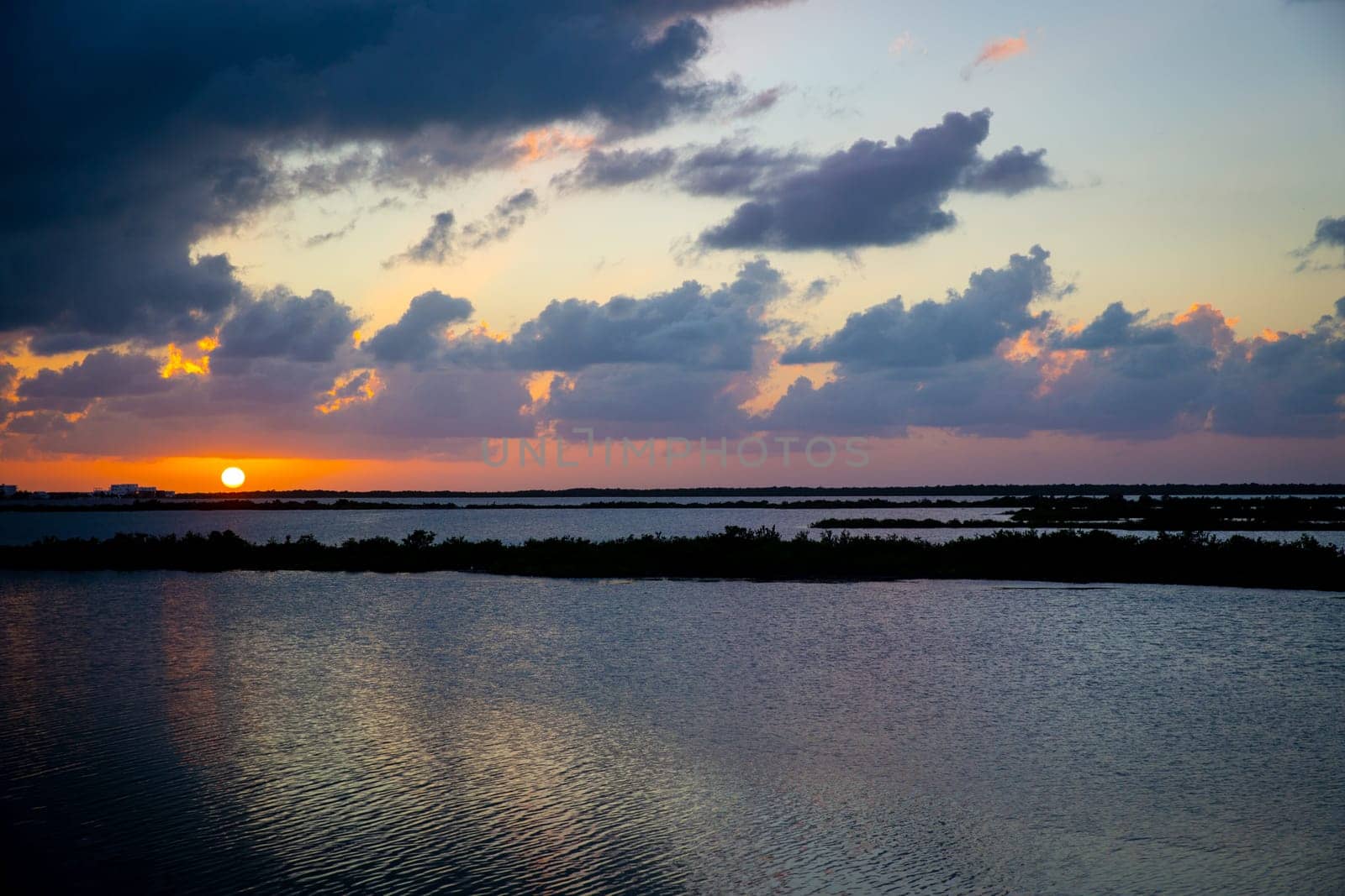 Sunset in San Pedro bay in Belize with the sun setting