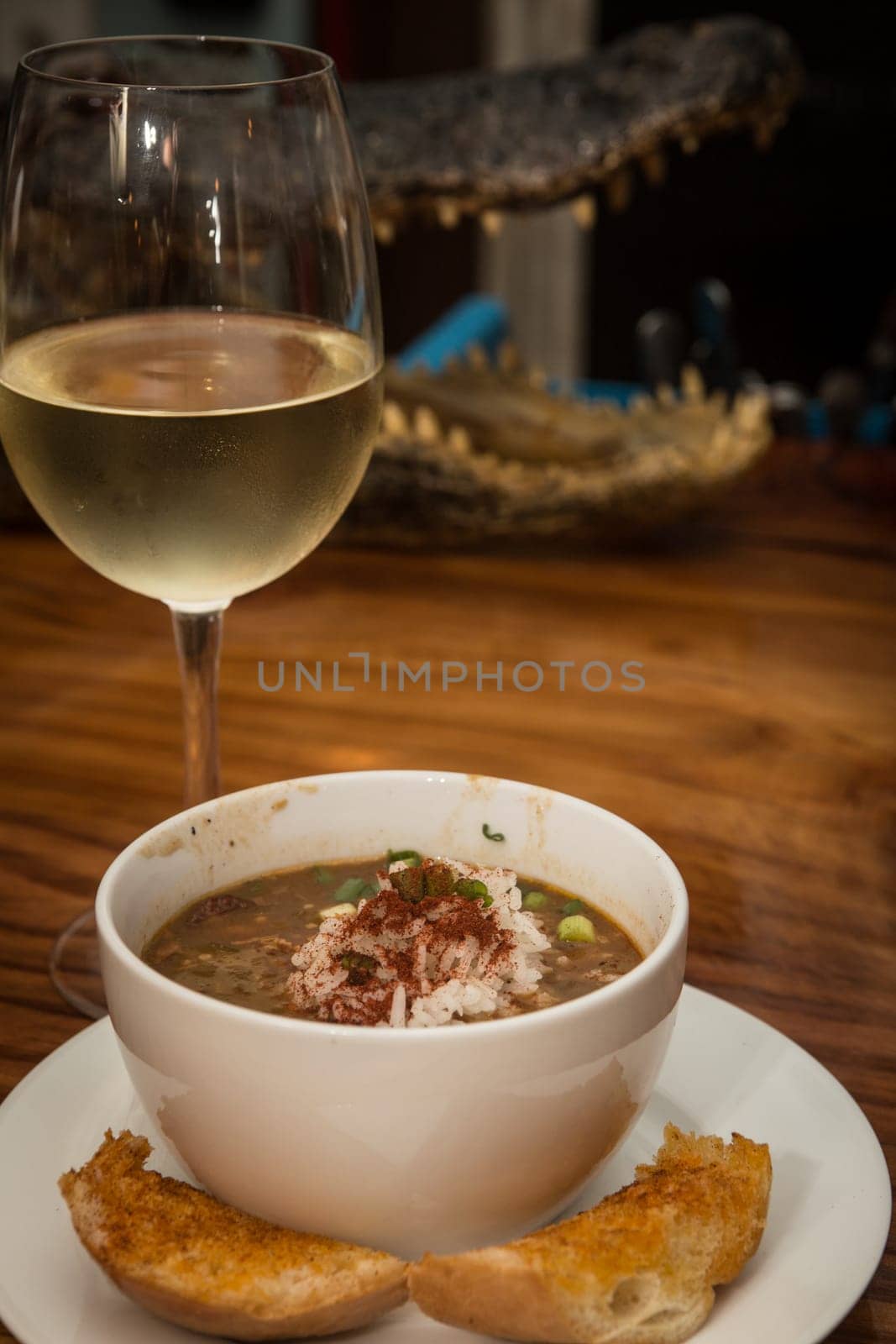 Gumbo and Wine with garlic bread at a cajun restaurant