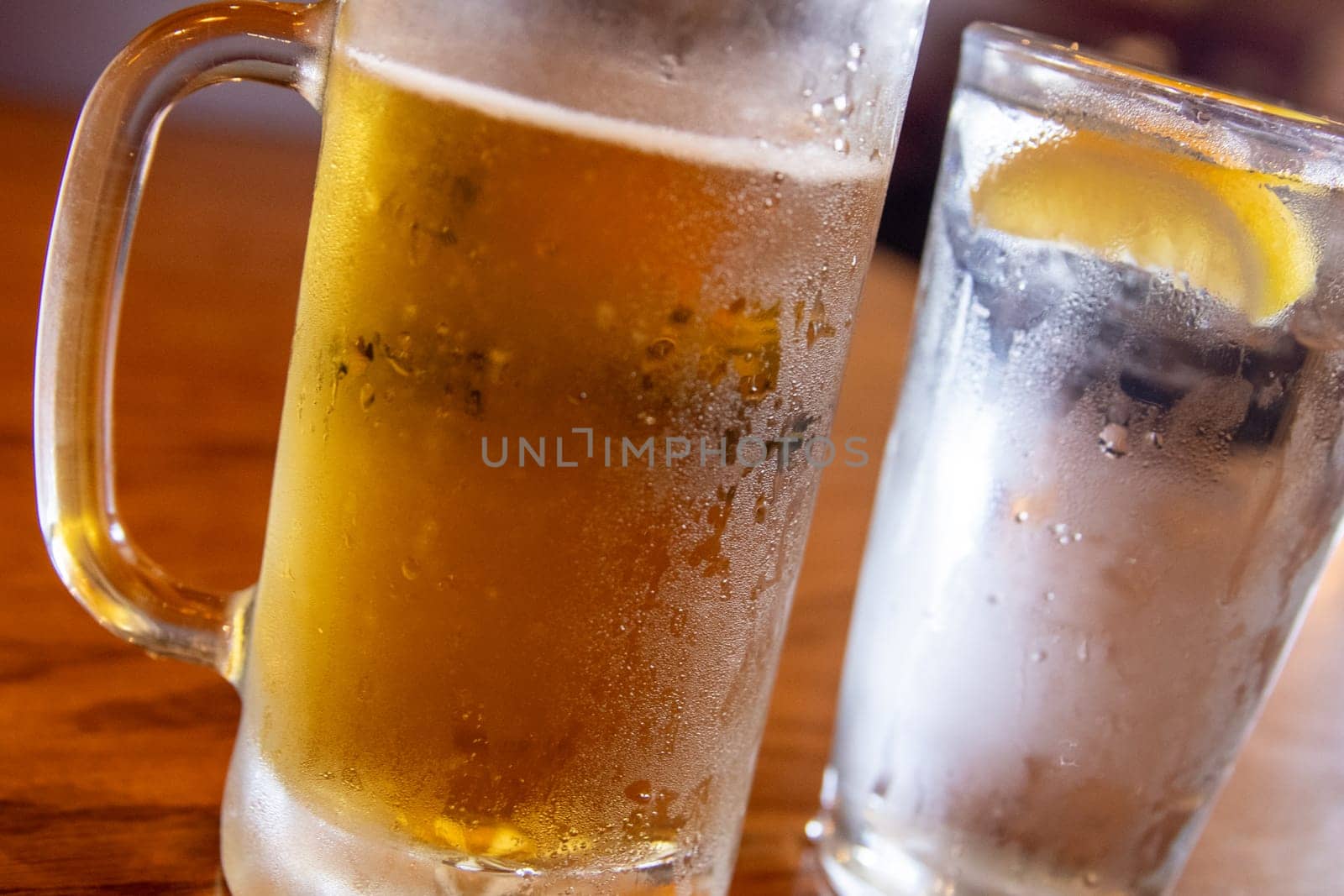 Light beer and water with condensation