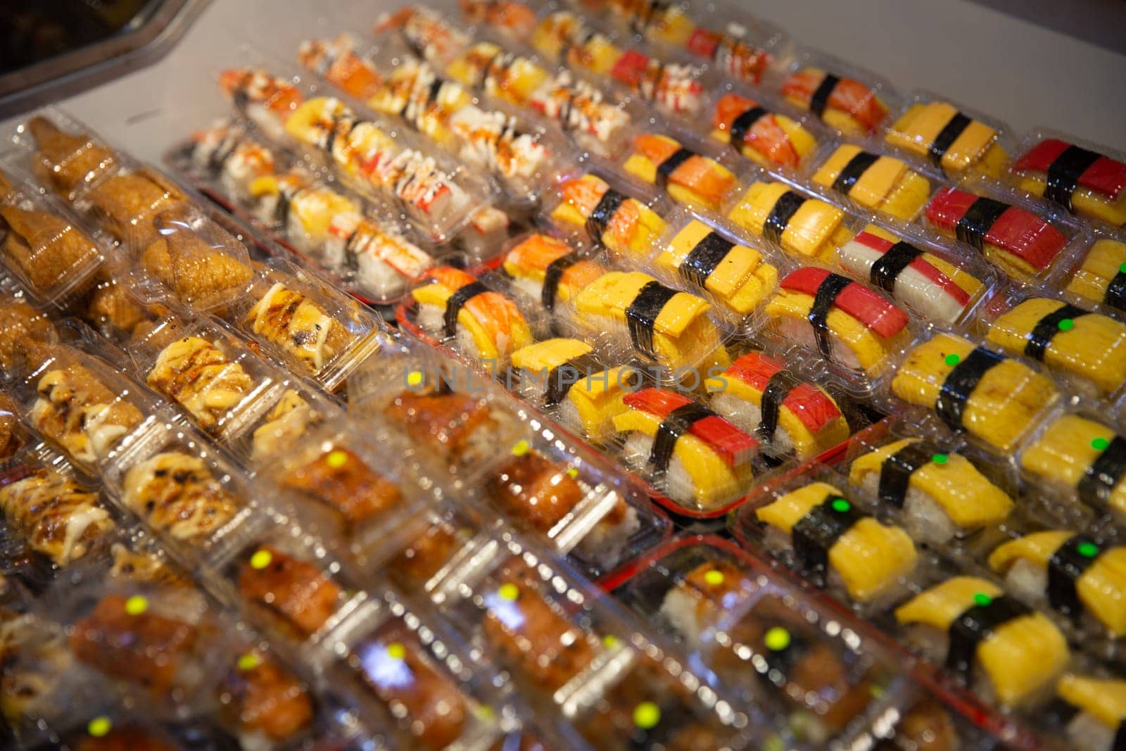 Bunch of Mini sushi on display to buy