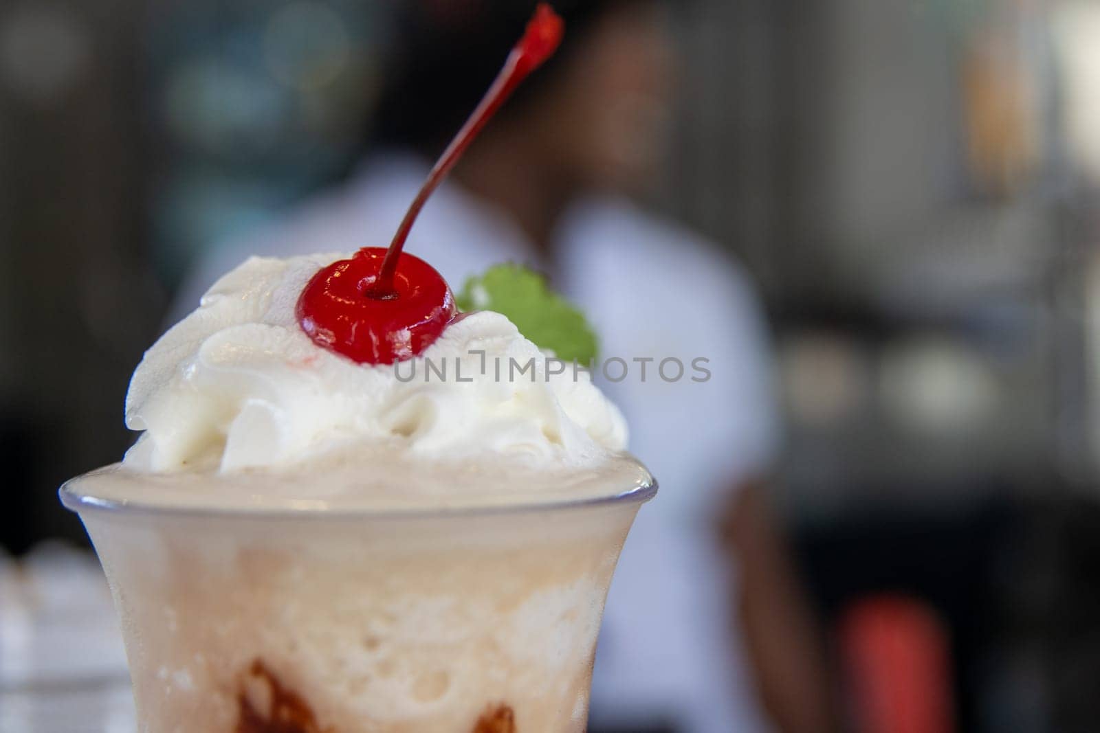 Whipped cream topping with a cherry