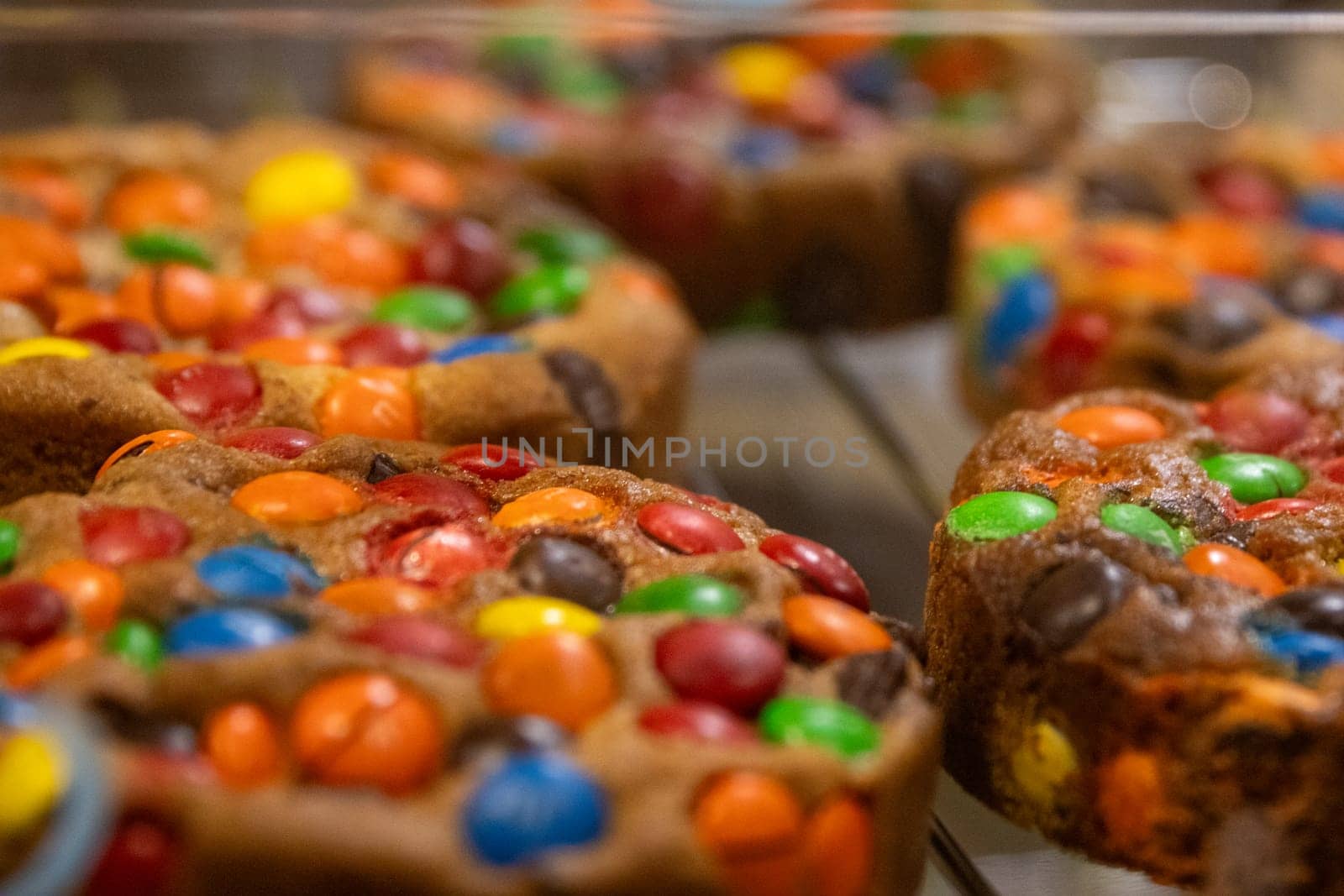 Rainbow candies as a cookie topping freshly baked
