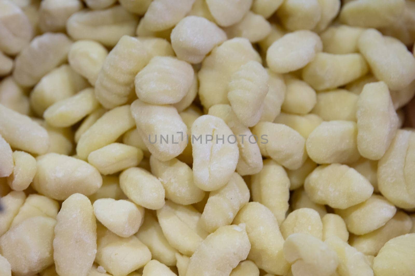 Fresh uncooked potato gnocci at a market