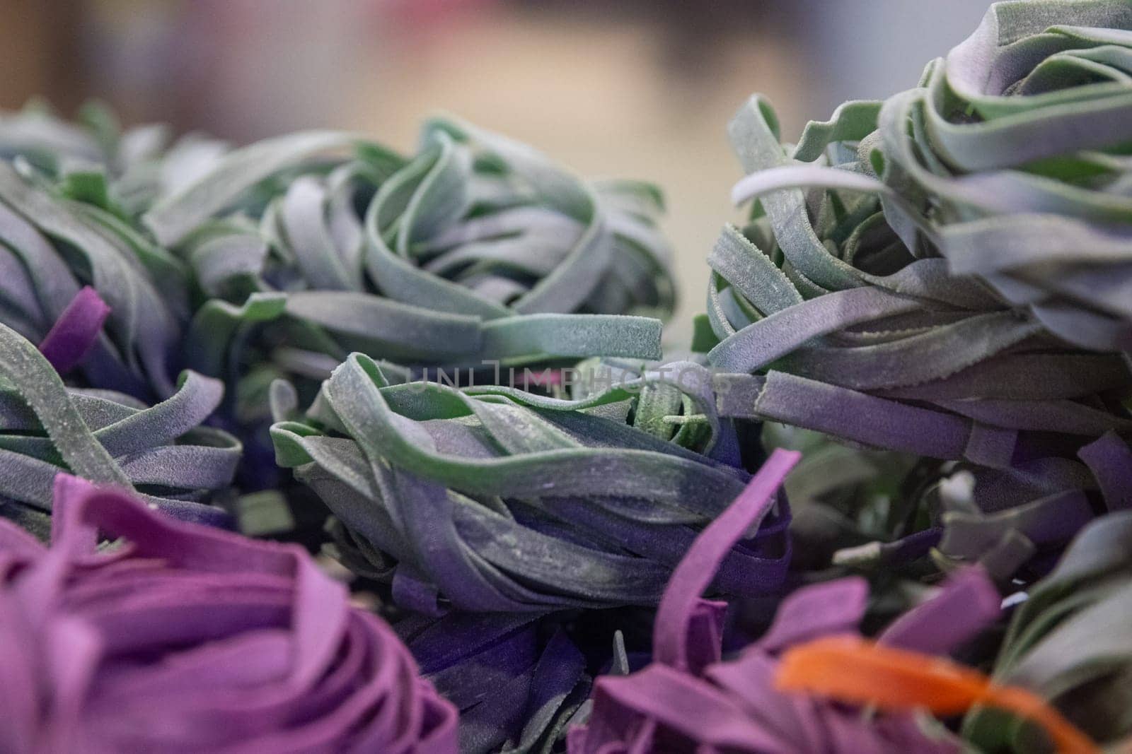 infused variety of pasta nests at a market