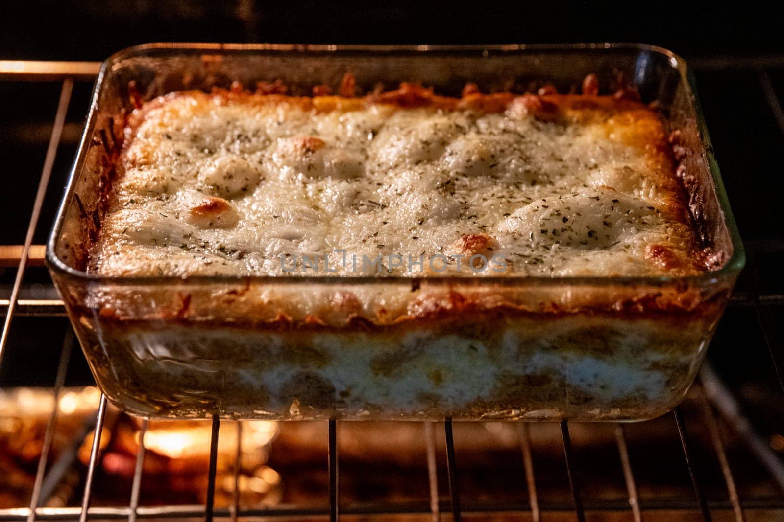 Pasta bake in the oven bubbling and cheesy