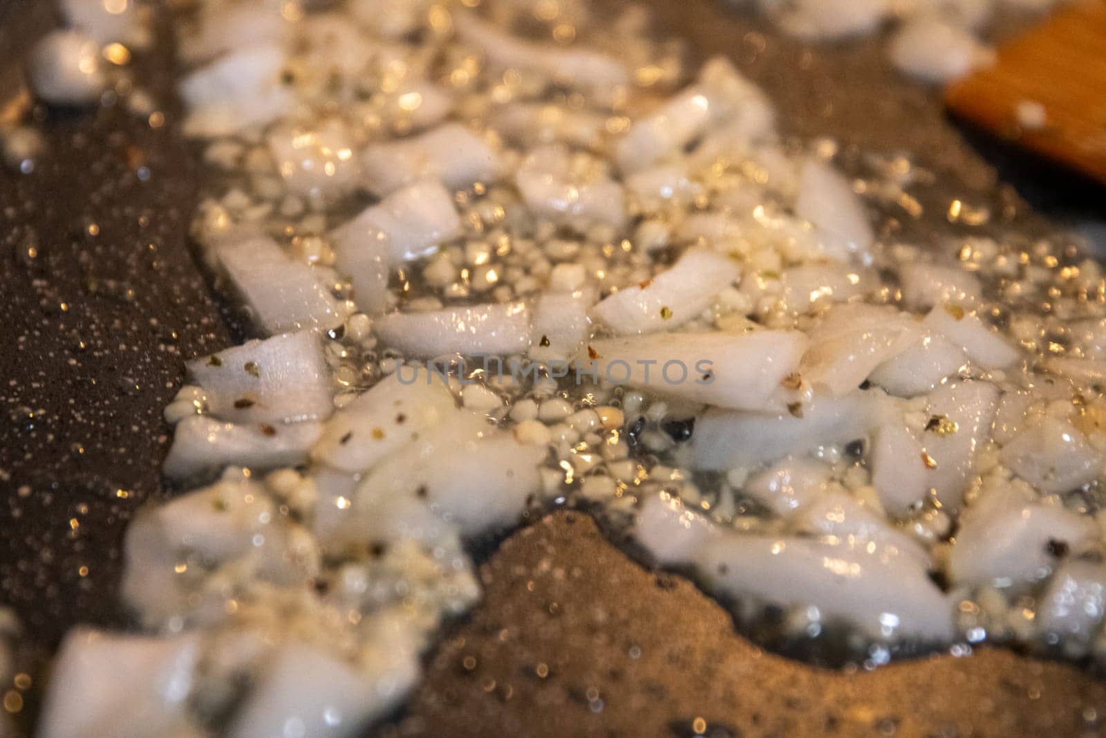 Frying onions and garlic before adding the main ingredients