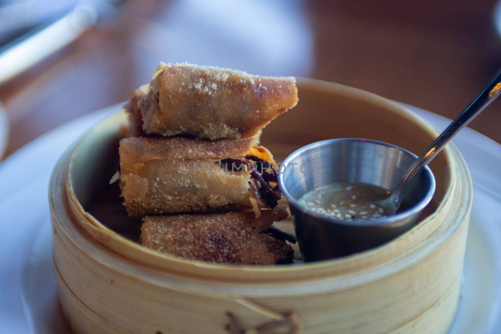 Fried Spring Roll served in a bamboo steamer