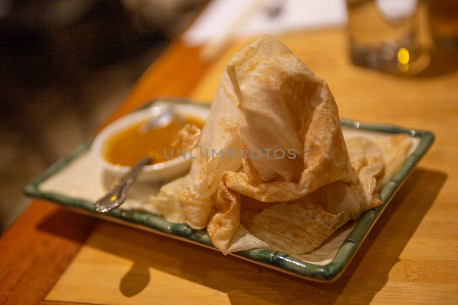 Roti Canai with Curry Sauce as an appetizer