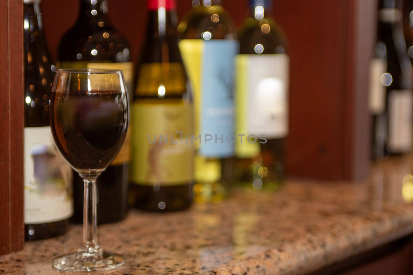 Glass of red wine on a bar