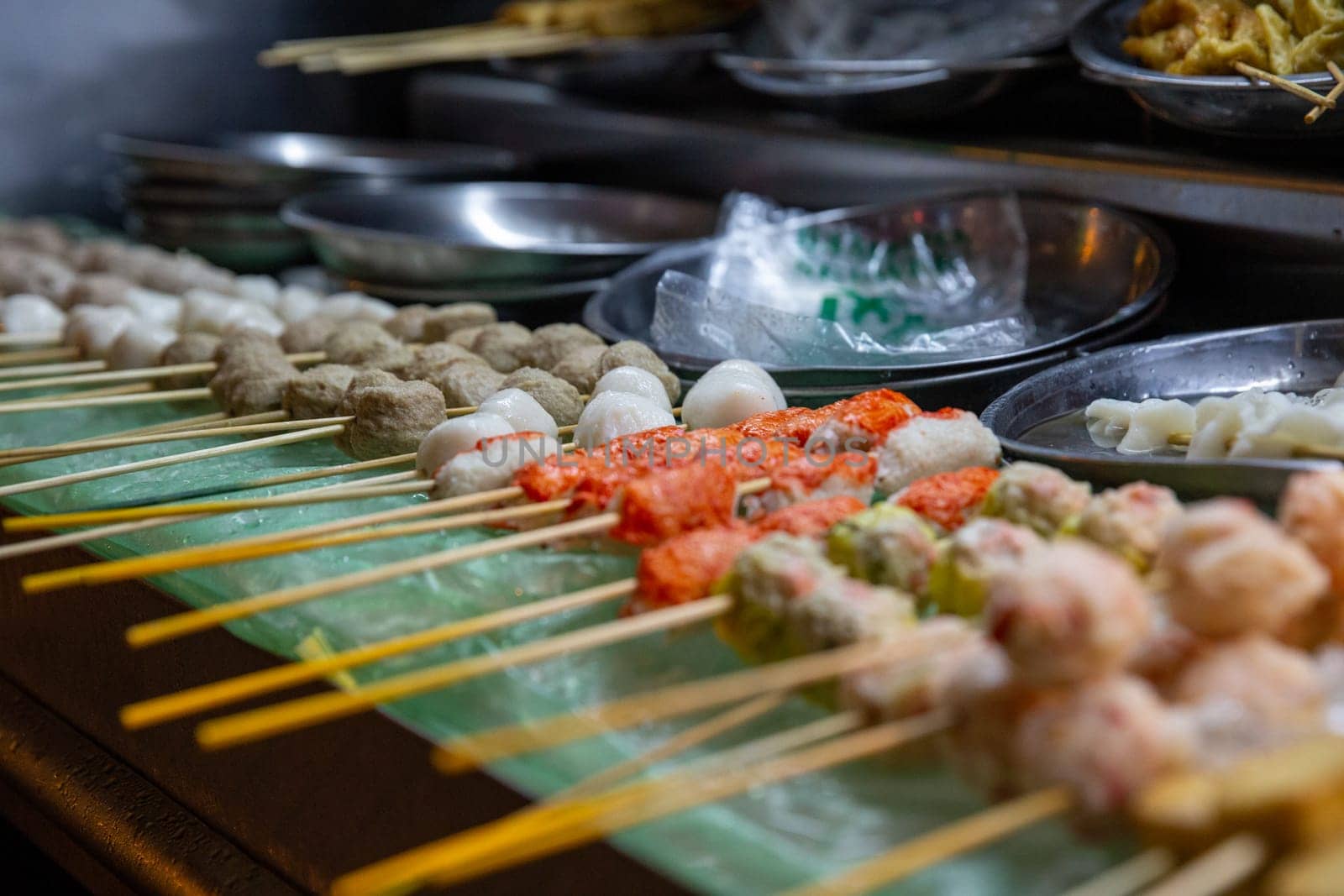 Skewers of Different Seafood Balls Ready to. be cooked
