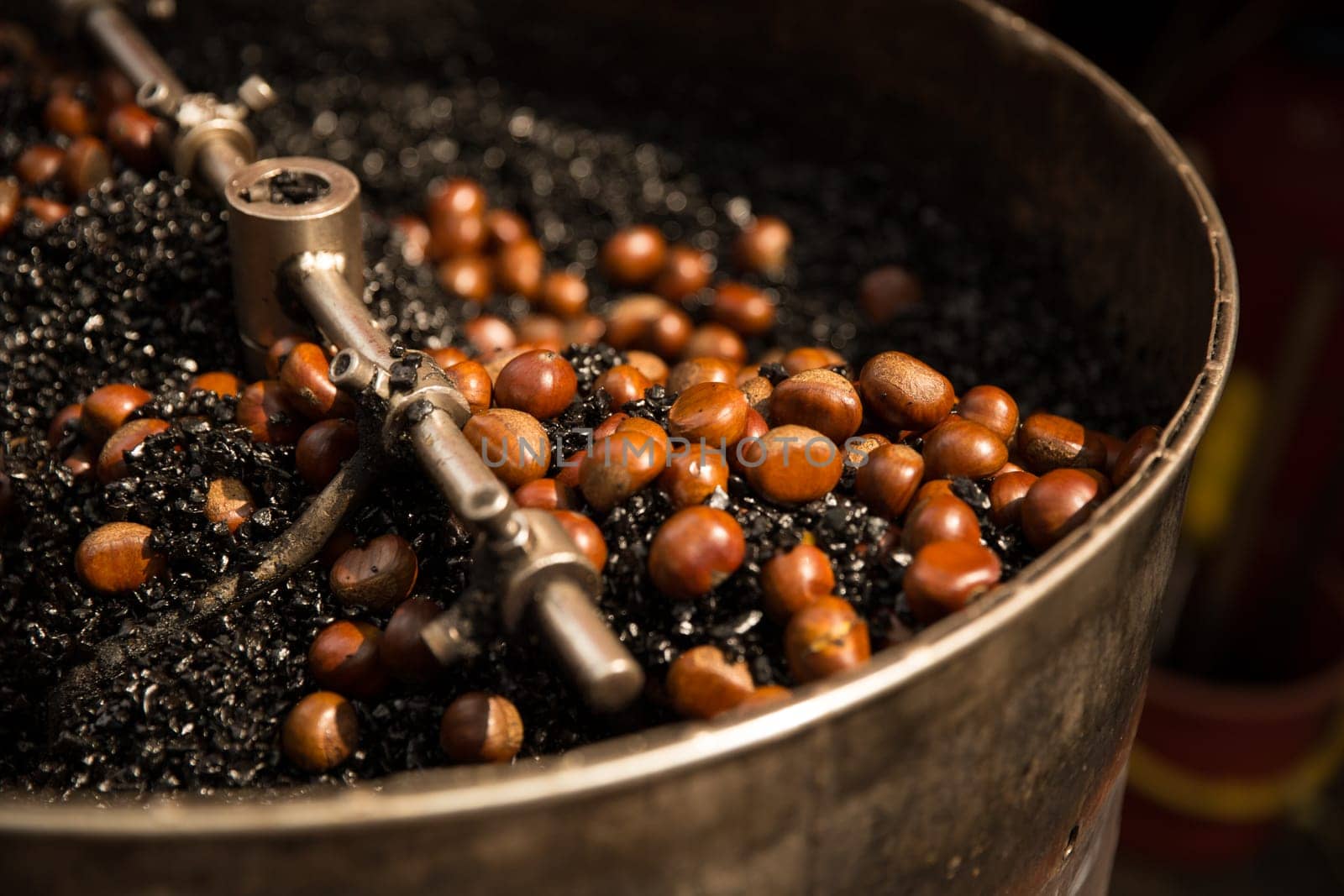 Roasting  Chestnuts on hot Coal churning