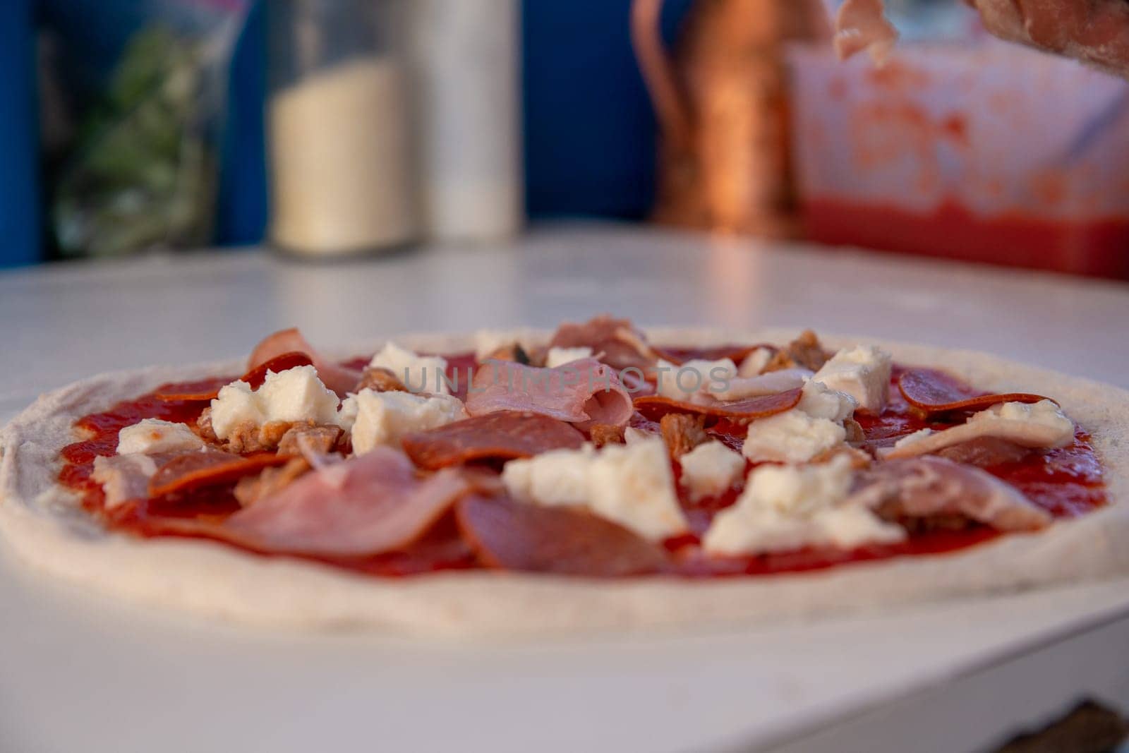 bacon and Pepperoni pizza about to be cooked