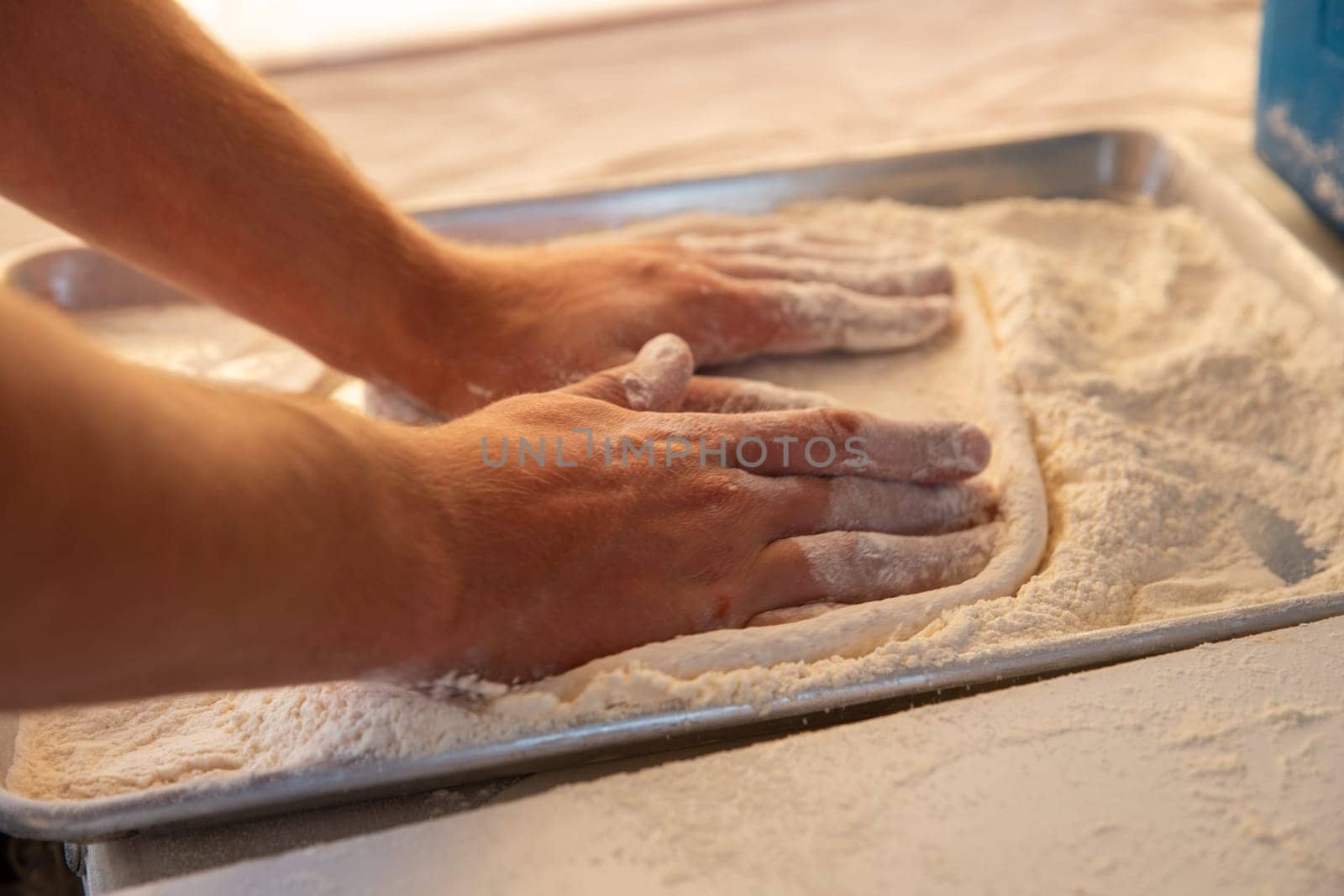 Chef making dough for the crust of a pizza
