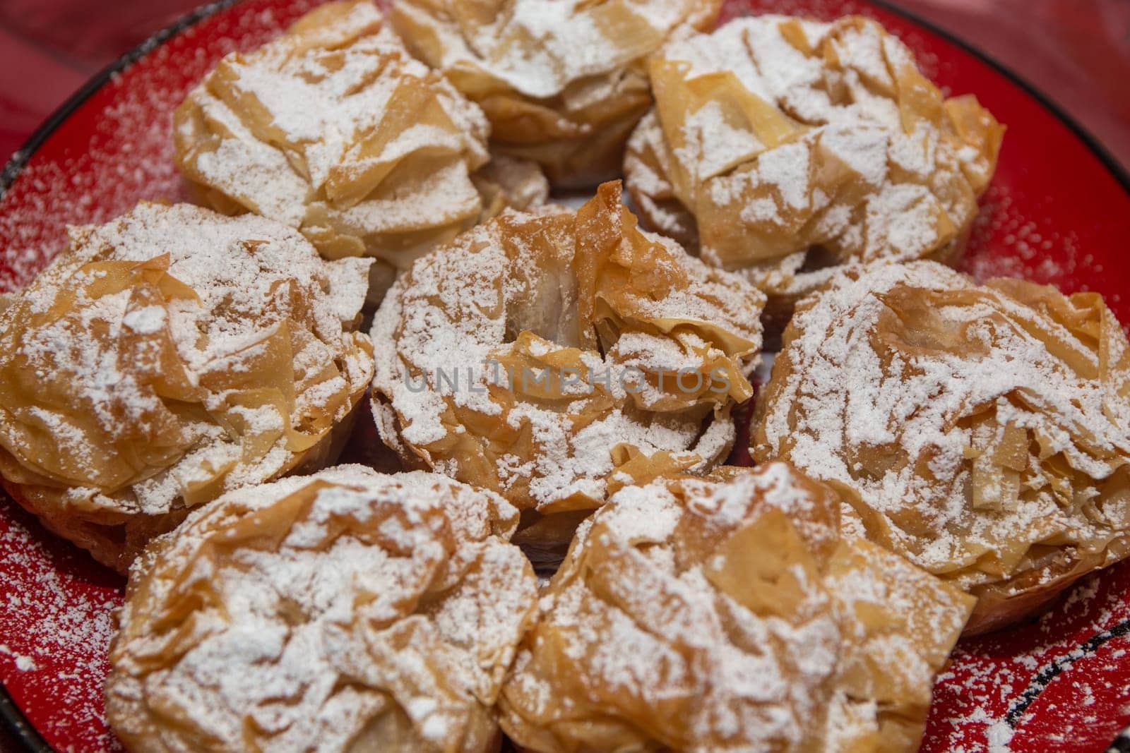 Persian Cream Puffs covered in powdered sugar