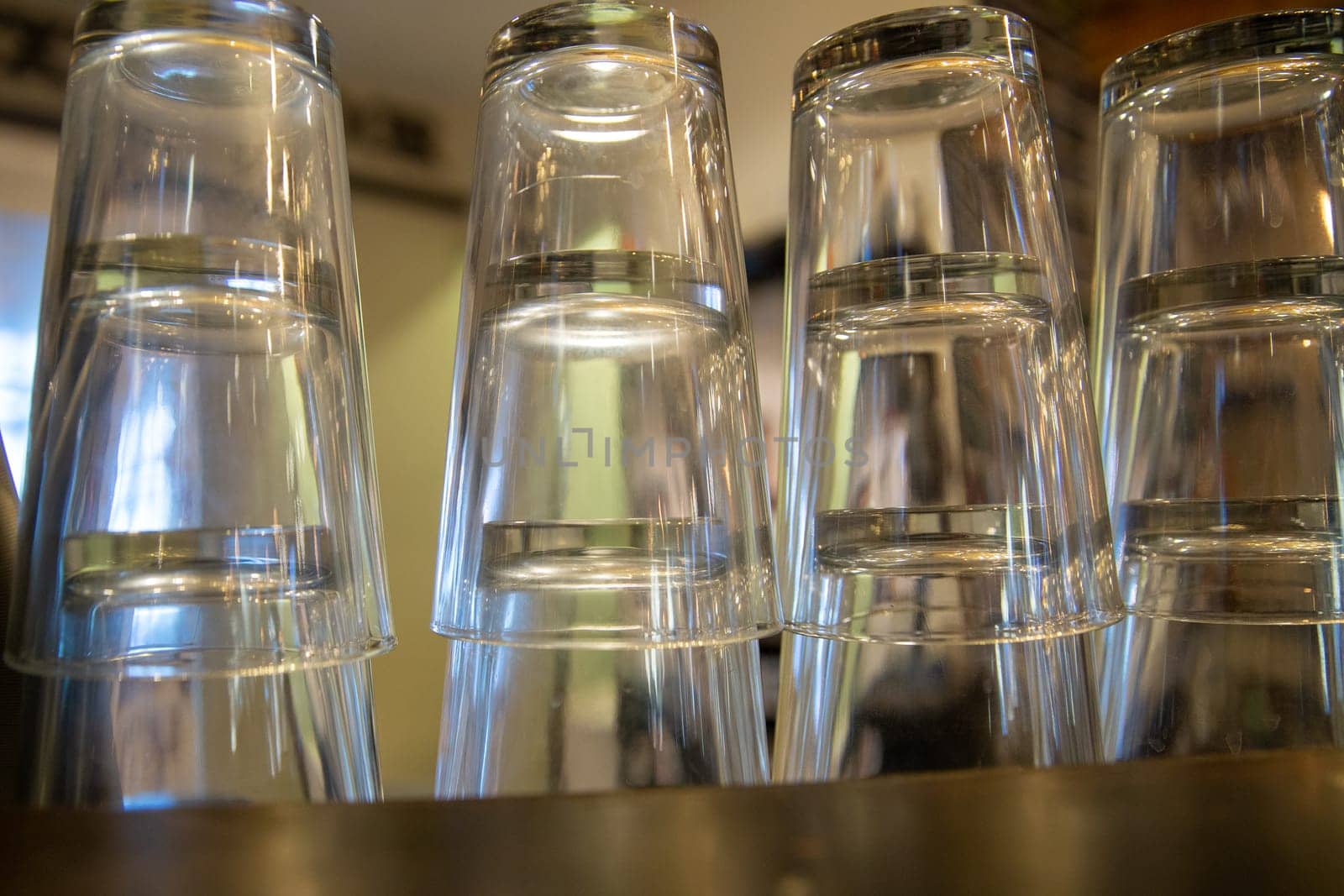Empty Beer glasses on the bar stacked