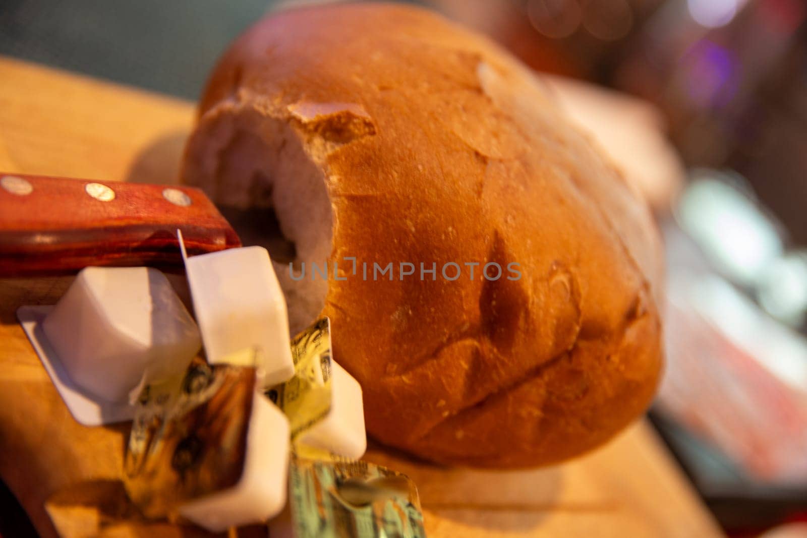 Loaf of bread with containers of butter