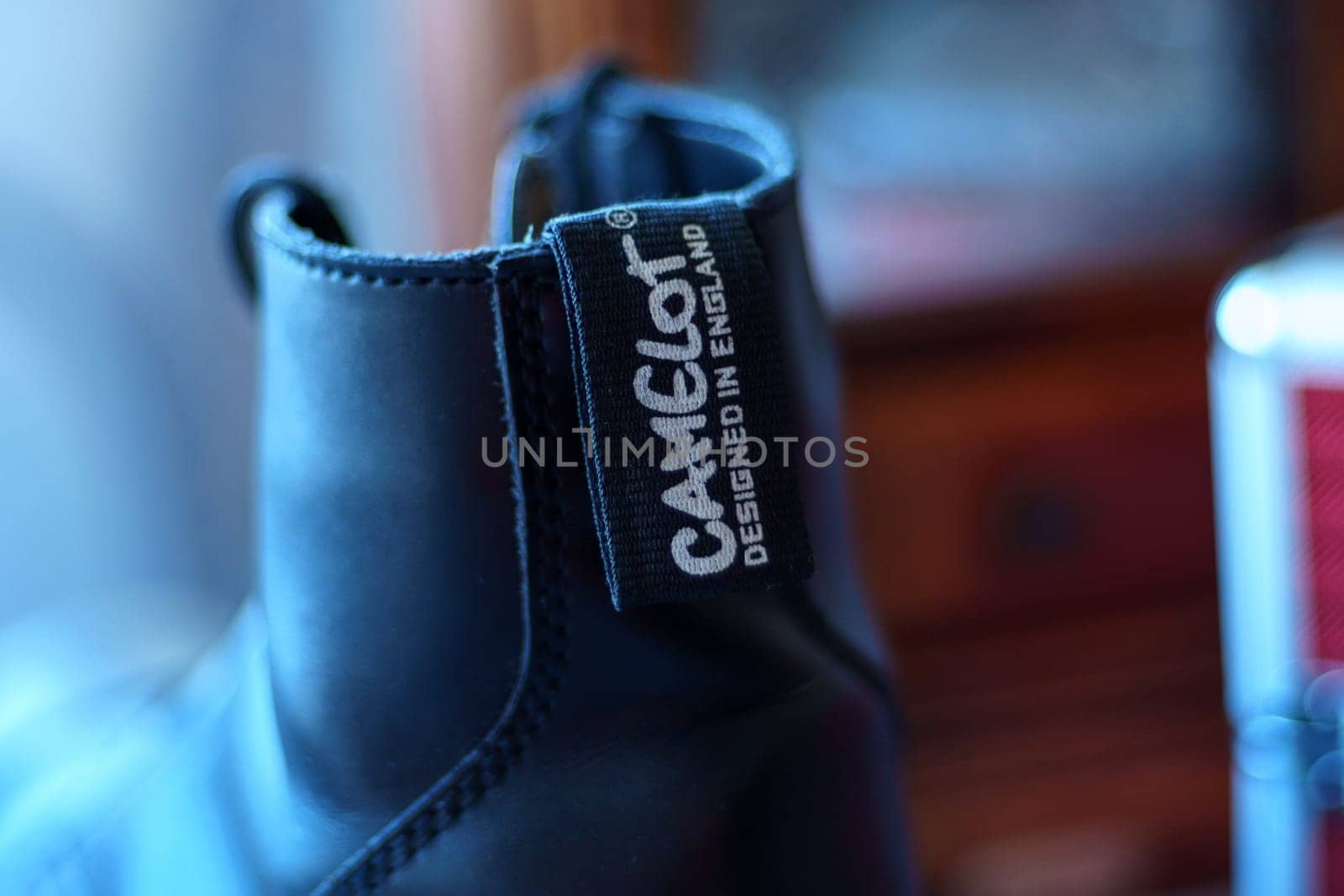 Tyumen, Russia-January 11, 2024: Black shoe featuring a Camelot brand name tag attached to it, showcasing the unique branding of the footwear. by darksoul72