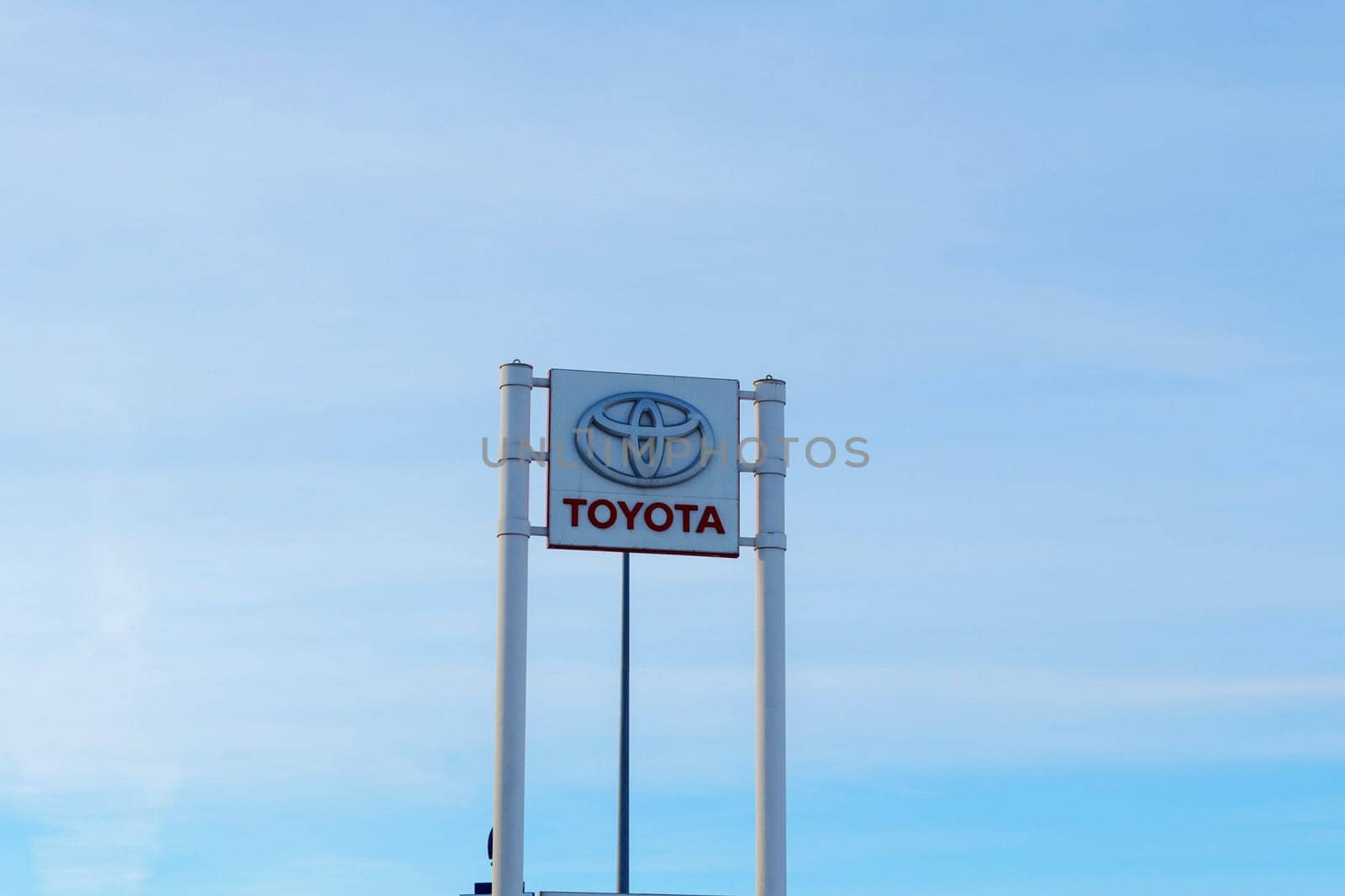 Tyumen, Russia-March 02, 2024: Toyota sign standing prominently against a clear blue sky, showcasing the iconic brand logo by darksoul72