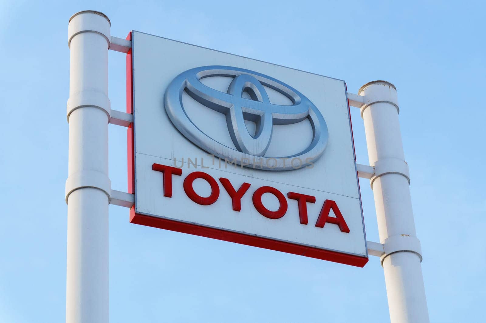 Tyumen, Russia-March 02, 2024: Toyota sign standing prominently against a clear blue sky, showcasing the iconic brand logo by darksoul72