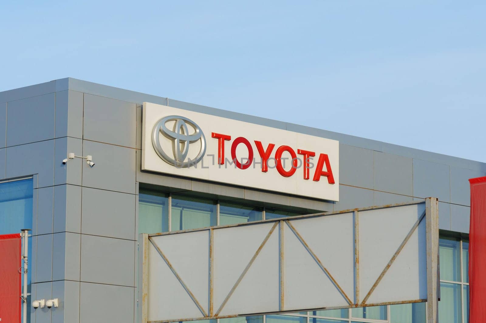 Tyumen, Russia-March 02, 2024: Toyota logo Sign Against Blue Sky. Selective focus