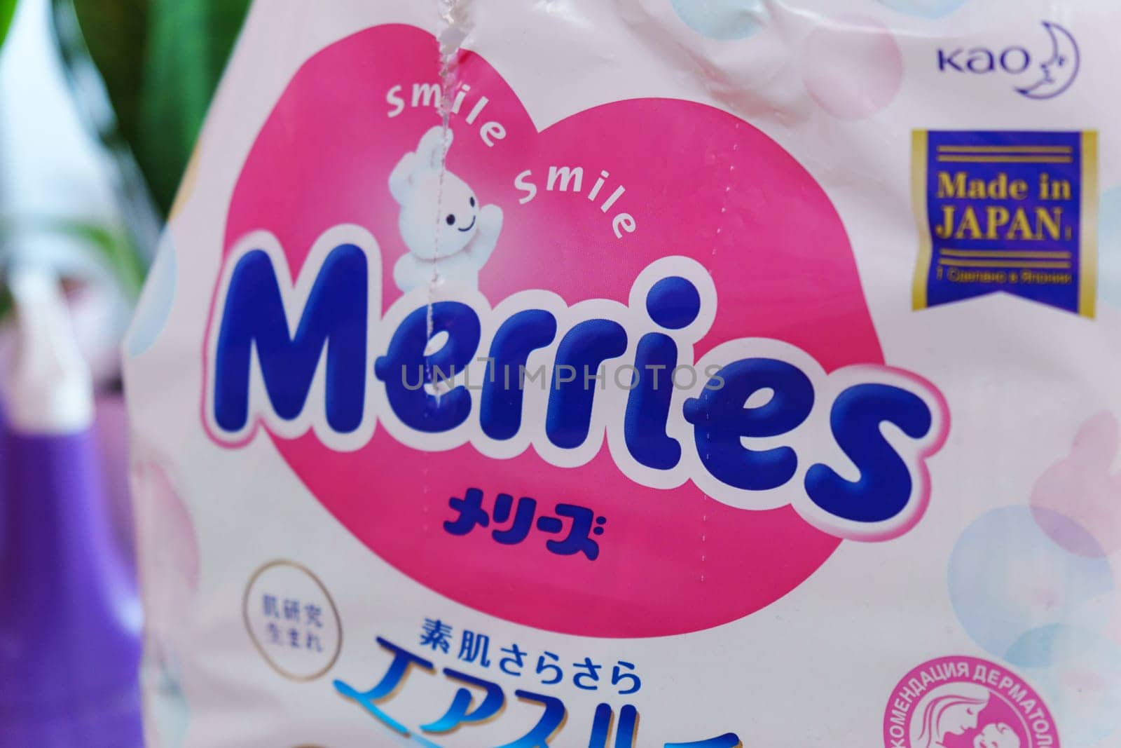 Tyumen, Russia-March 02, 2024: Merries diapers is casually placed on top of a wooden floor, showcasing the brands logo