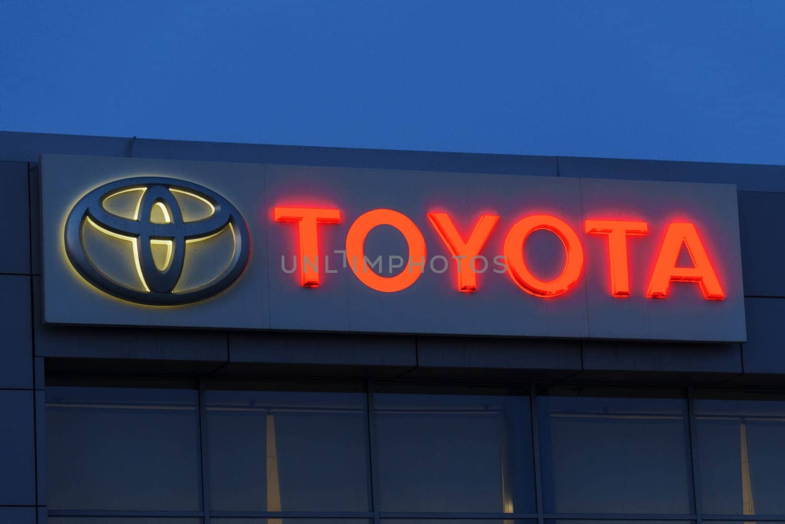 Tyumen, Russia-March 02, 2024: Toyota brand logo sign prominently displayed on the side of a commercial building in a city. by darksoul72