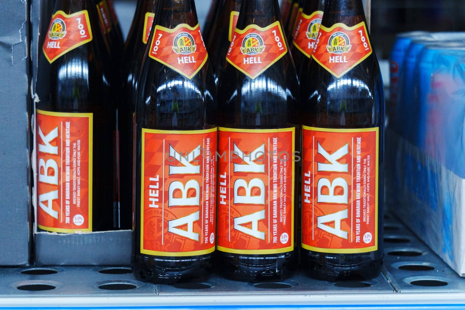 Tyumen, Russia-March 02, 2024: ABK lager beer bottles close up supermarket shelf. Selective focus by darksoul72