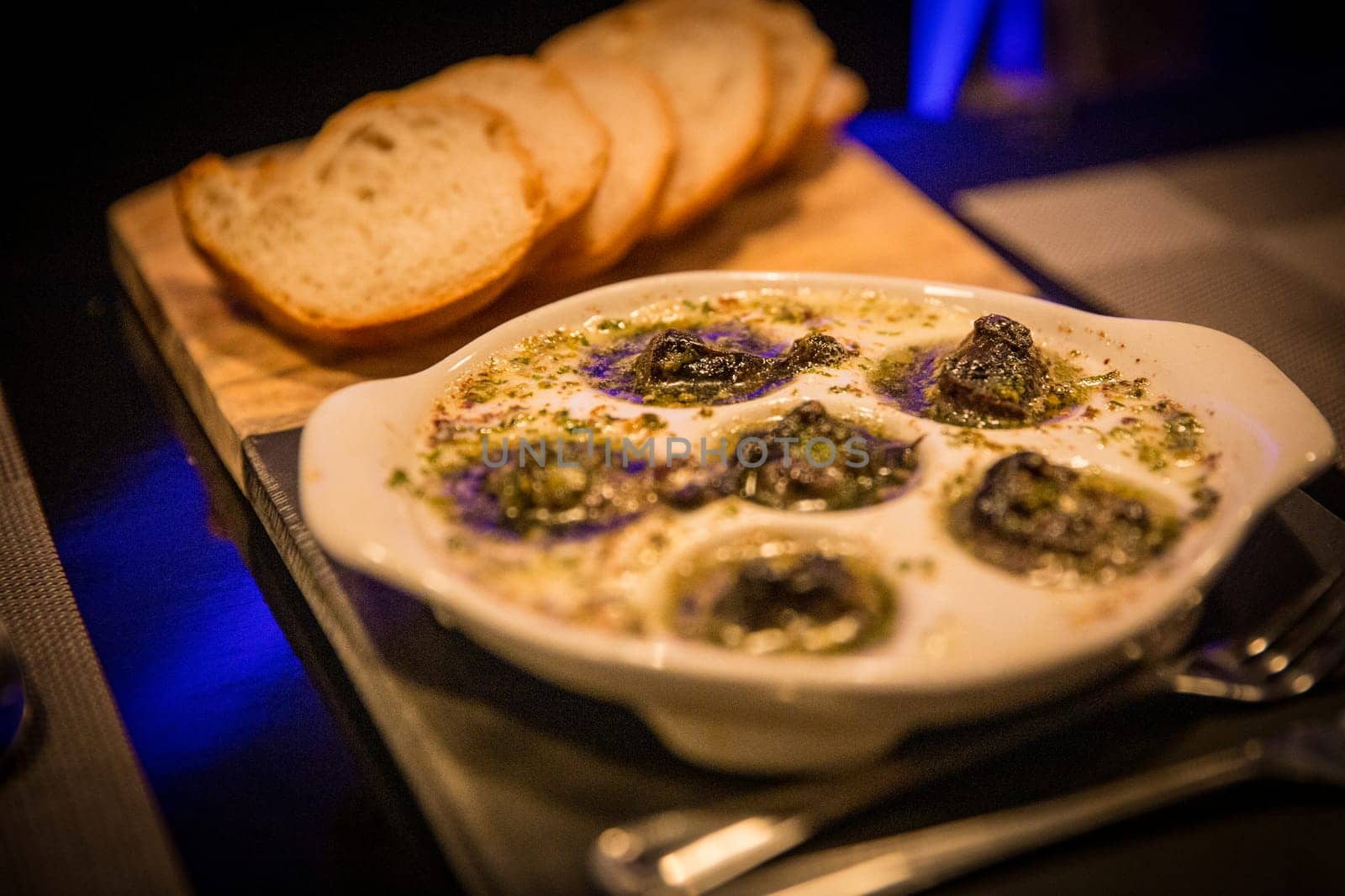 Escargot with french bread and Silverware