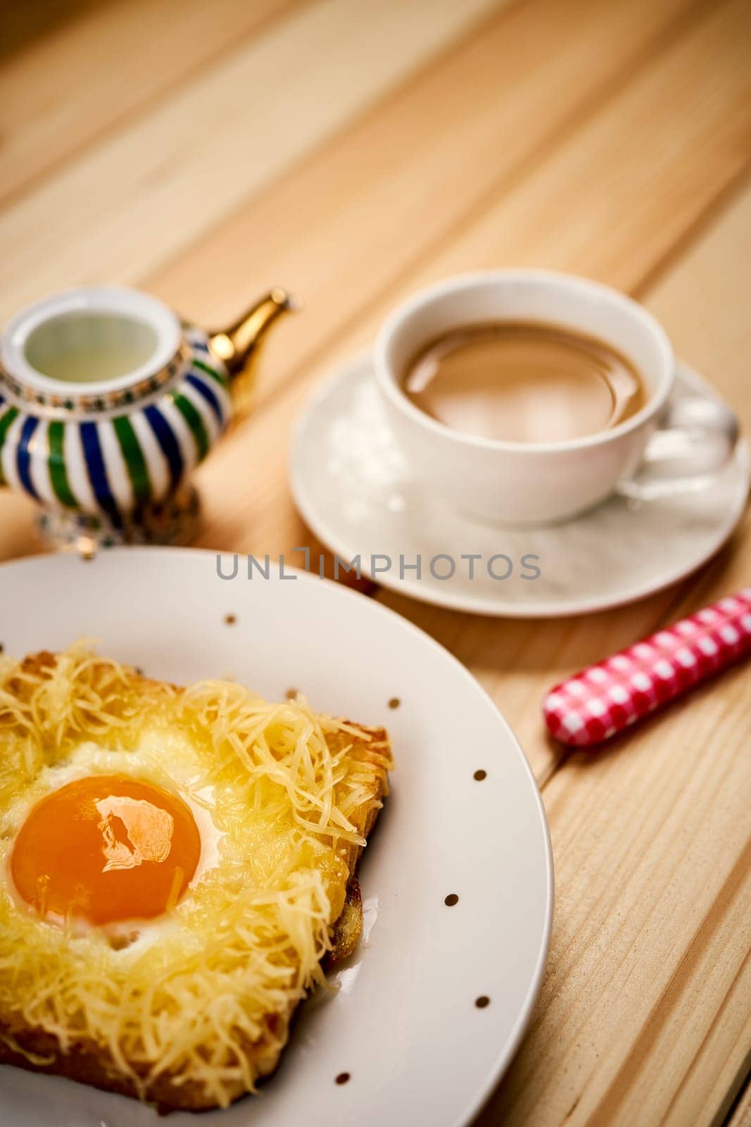 breakfast set with coffee and toast with egg on wooden table by superstellar