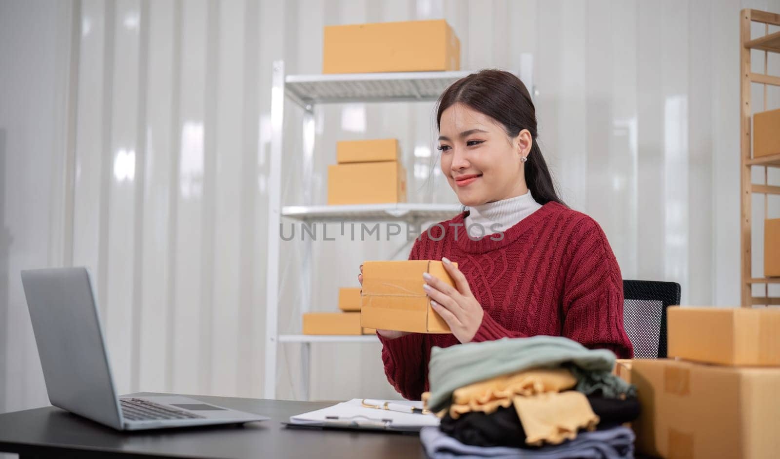 SME business entrepreneurs small in asia Preparing cardboard boxes in home office Small business operators preparing to ship to customers.