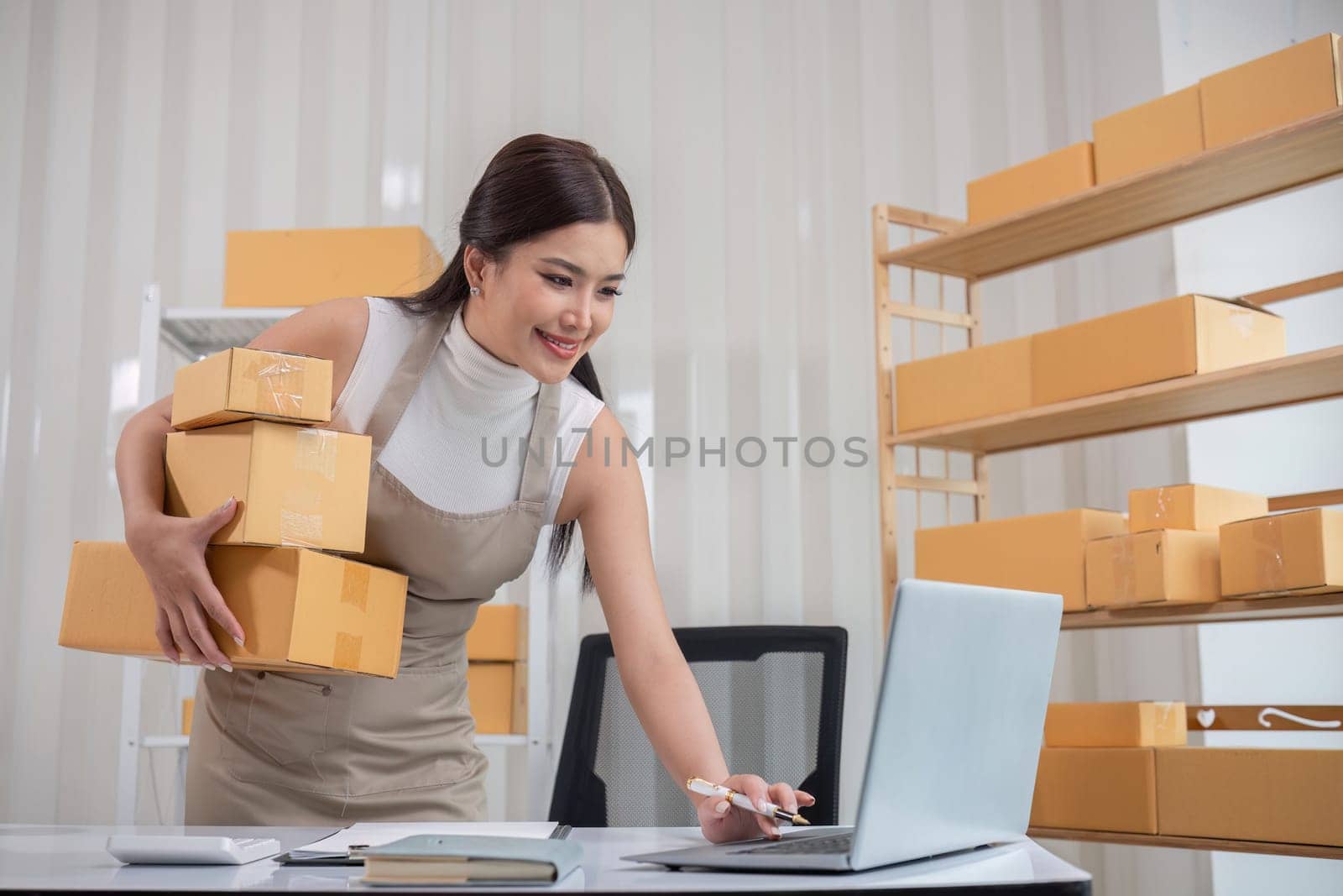 SME business entrepreneurs small in asia Preparing cardboard boxes in home office Small business operators preparing to ship to customers.