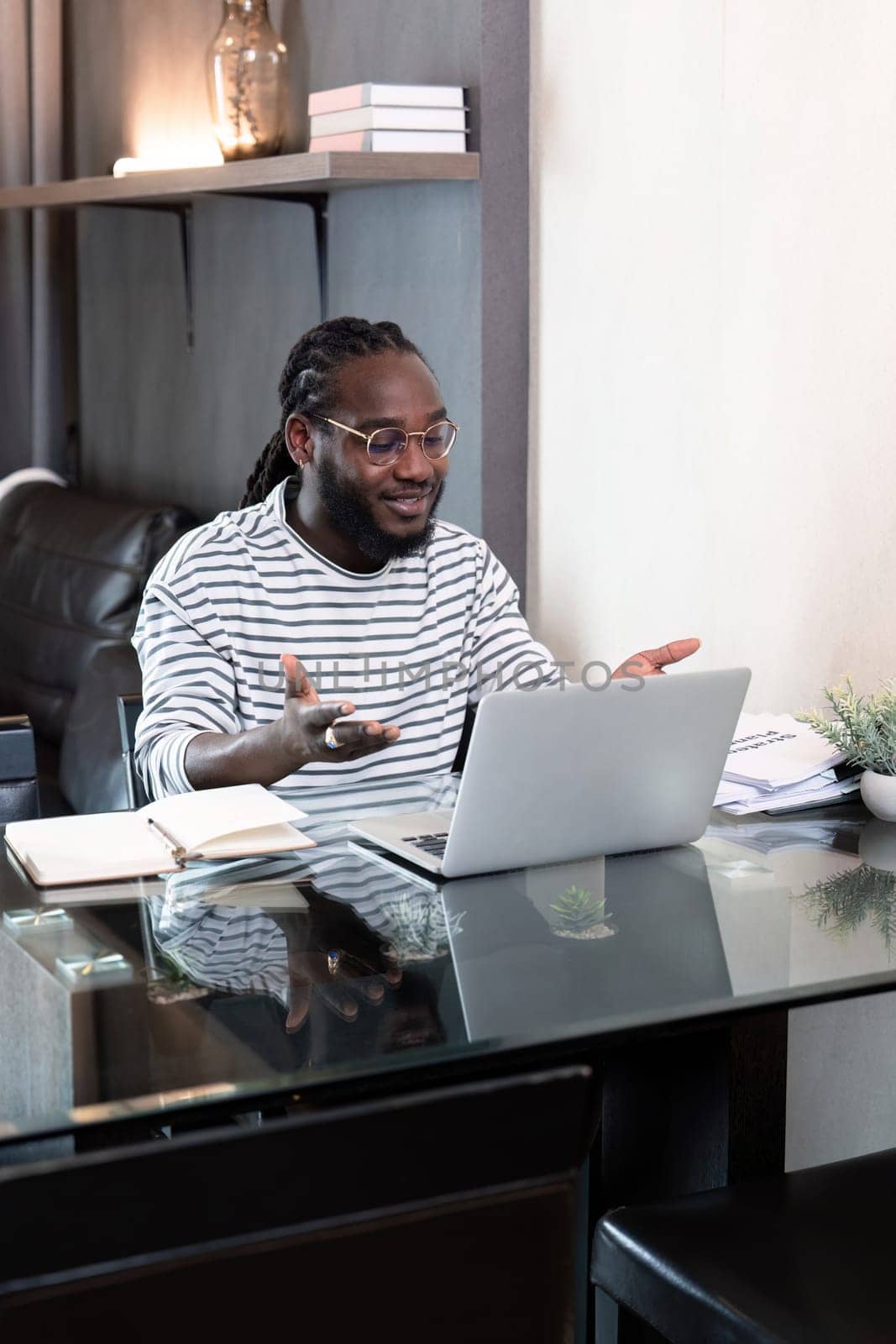 African american business afro man live online meeting on computer home. Freelance online sme marketing, young happy man video call meeting on laptop alone at home.