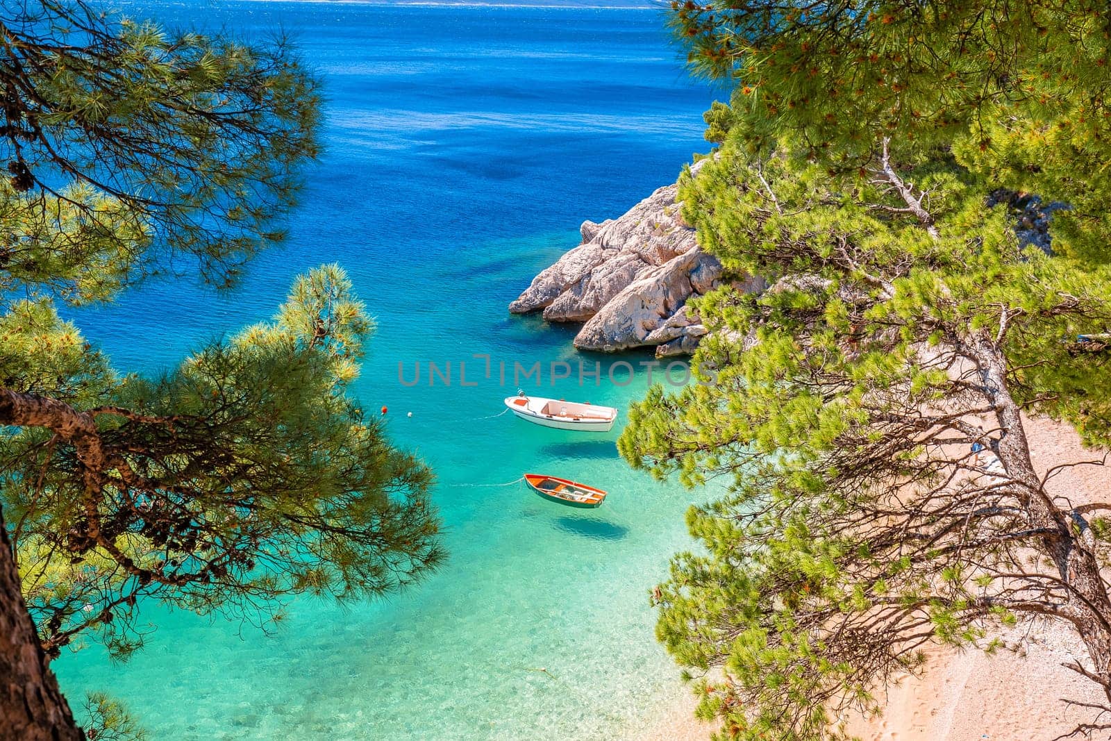 Idyllic beach Punta Rata in Brela view through Mediterranean trees by xbrchx