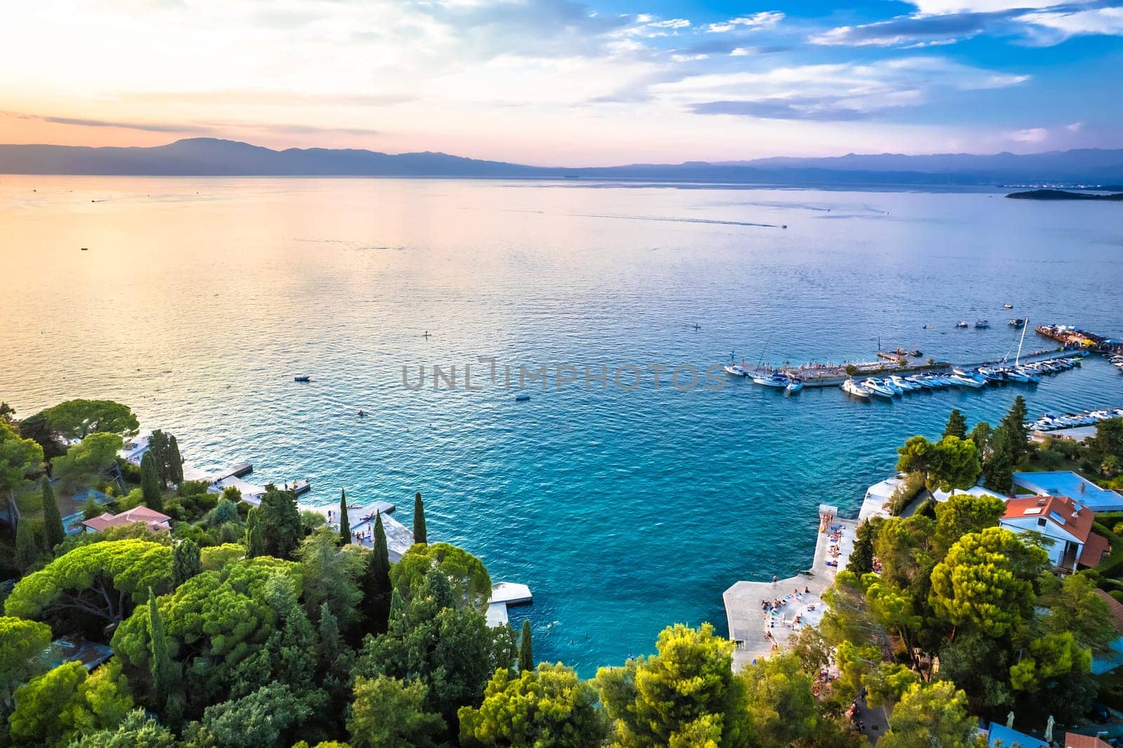 Malinska waterfront beach and turquoise coastline sunset view, Island of Krk tourist destination in Croatia