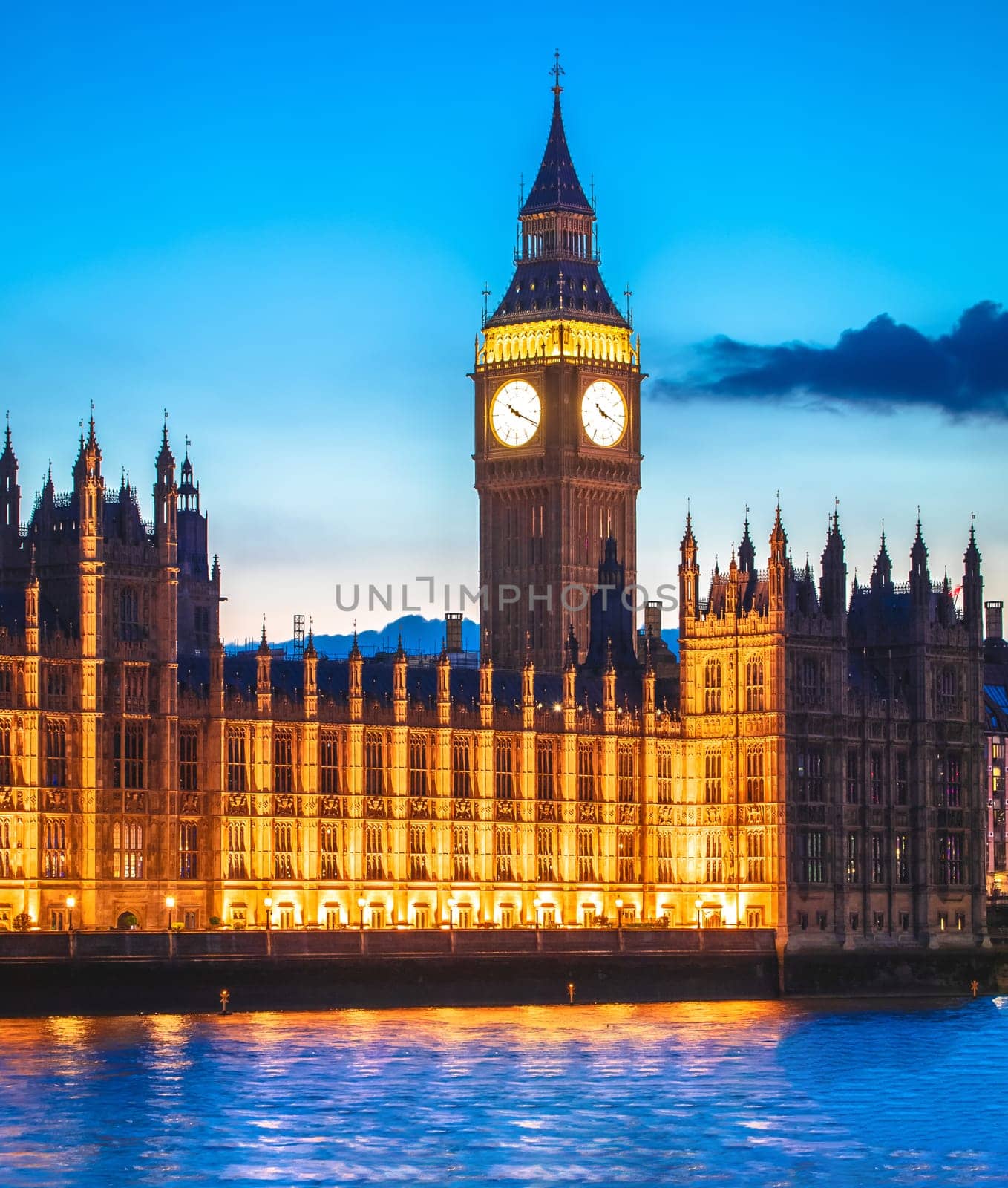 Big Ben clock tower in London sundown view from Thames river, capital of UK famous landmark