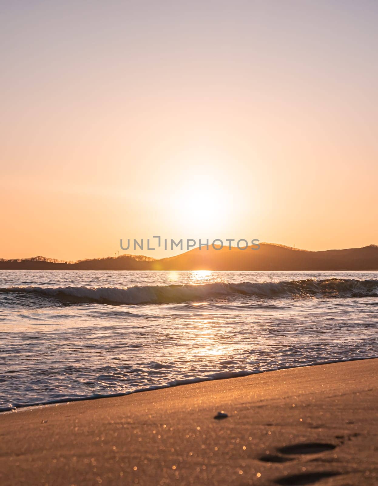 Sunset on the beach. Orange and golden sunset sky calmness tranquil relaxing sunlight summer mood.